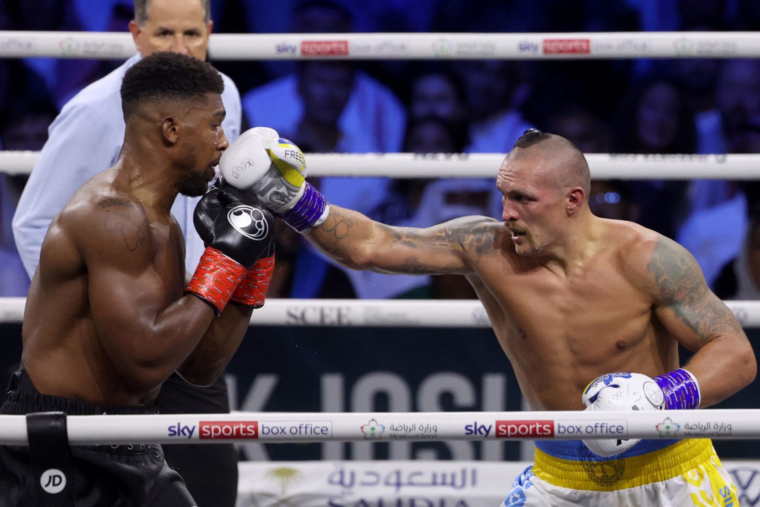 Ukraine's Oleksandr Usyk (R) and Britain's Anthony Joshua (L) compete during the heavyweight boxing rematch for the WBA, WBO, IBO and IBF titles, at the King Abdullah Sports City Arena in the Saudi Red Sea city of Jeddah, on August 20, 2022. - Usyk won his rematch against Anthony Joshua by split decision to retain his world heavyweight titles in just his fourth fight in the division in Saudi Arabia late tonight. (Photo by Giuseppe CACACE / AFP) (Photo by GIUSEPPE CACACE/AFP via Getty Images) Ukraine's Oleksandr Usyk (R) and Britain's Anthony Joshua (L) compete during the heavyweight boxing rematch for the WBA, WBO, IBO and IBF titles, at the King Abdullah Sports City Arena in the Saudi Red Sea city of Jeddah, on August 20, 2022. - Usyk won his rematch against Anthony Joshua by split decision to retain his world heavyweight titles in just his fourth fight in the division in Saudi Arabia late tonight. (Photo by Giuseppe CACACE / AFP) (Photo by GIUSEPPE CACACE/AFP via Getty Images)
