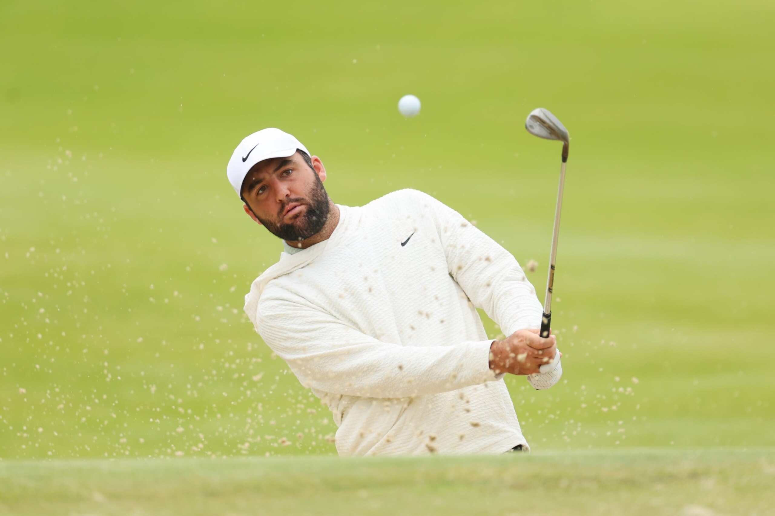 LOUISVILLE, KENTUCKY - MAY 14: Scottie Scheffler of the United States plays a shot from a bunker on the seventh hole during a practice round prior to the 2024 PGA Championship at Valhalla Golf Club on May 14, 2024 in Louisville, Kentucky. (Photo by Michael Reaves/Getty Images)