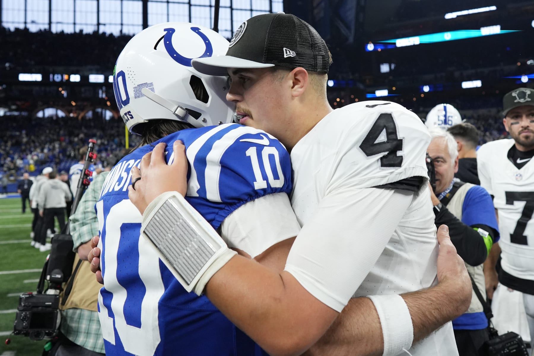 INDIANAPOLIS, INDIANA - DECEMBER 31: Gardner Minshew #10 of the Indianapolis Colts talks with Aidan O'Connell #4 of the Las Vegas Raiders after the game at Lucas Oil Stadium on December 31, 2023 in Indianapolis, Indiana. (Photo by Dylan Buell/Getty Images)