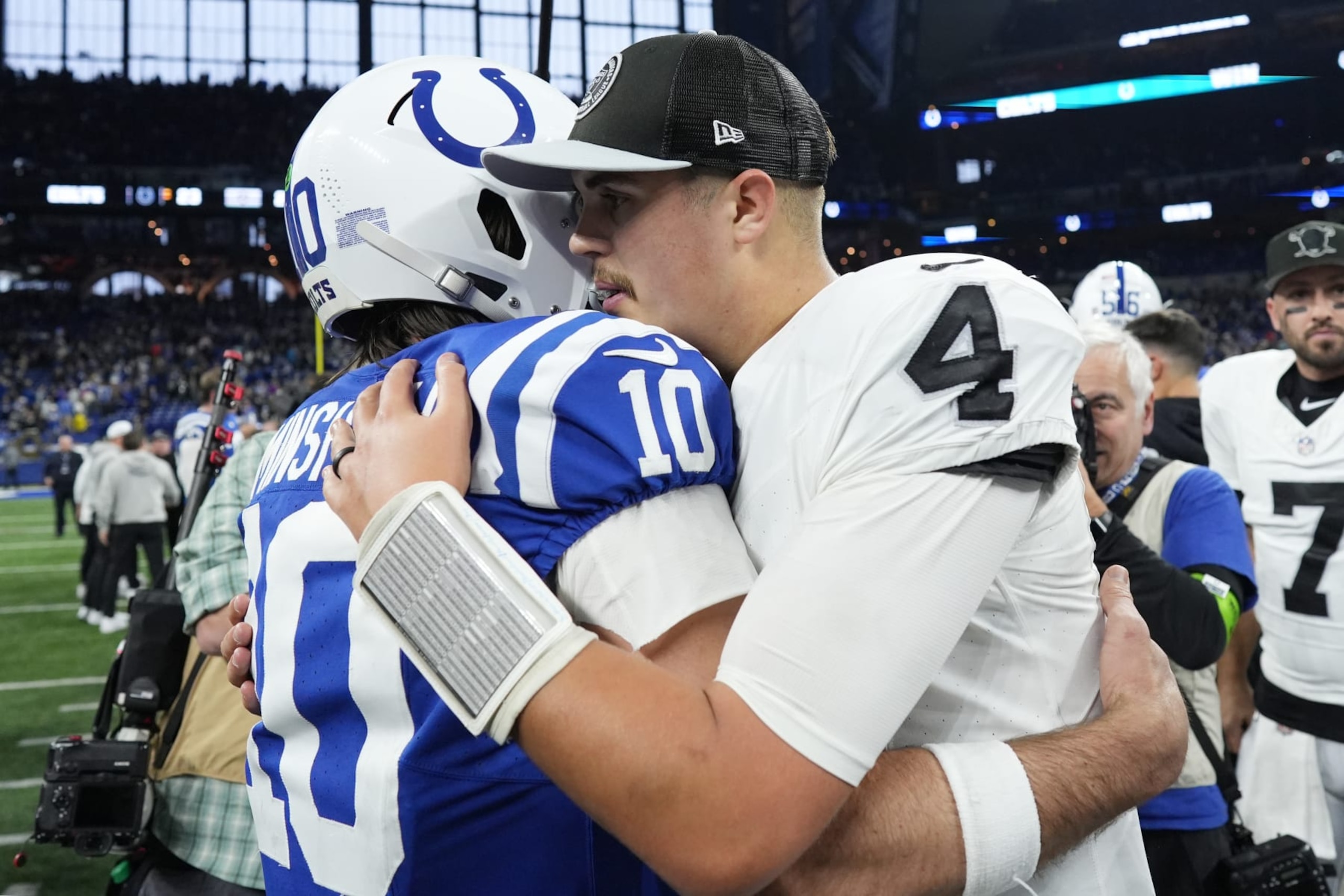 INDIANAPOLIS, INDIANA - DECEMBER 31: Gardner Minshew #10 of the Indianapolis Colts talks with Aidan O'Connell #4 of the Las Vegas Raiders after the game at Lucas Oil Stadium on December 31, 2023 in Indianapolis, Indiana. (Photo by Dylan Buell/Getty Images)
