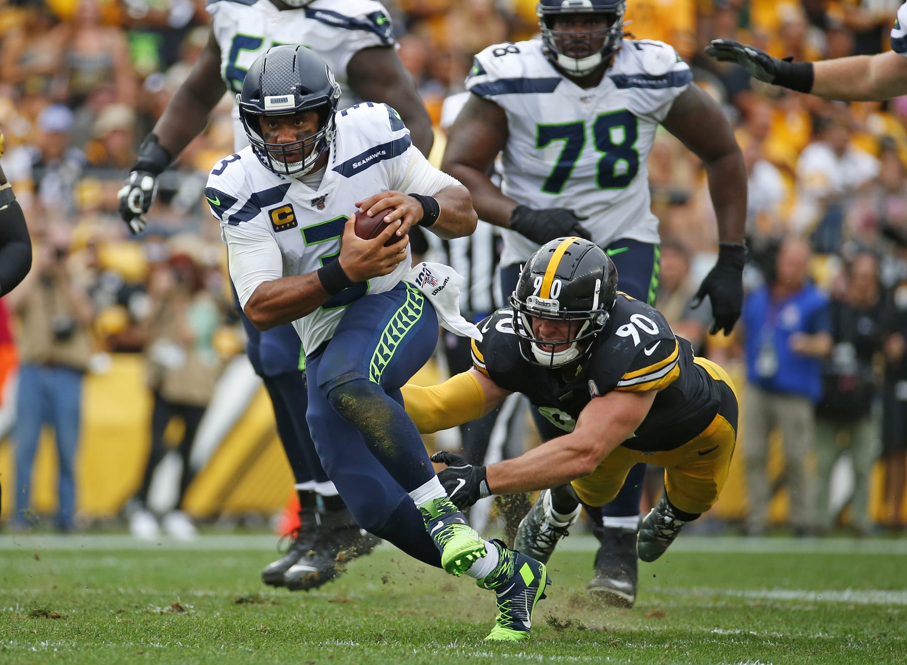 PITTSBURGH, PA - SEPTEMBER 15:  Russell Wilson #3 of the Seattle Seahawks in action against T.J. Watt #90 of the Pittsburgh Steelers on September 15, 2019 at Heinz Field in Pittsburgh, Pennsylvania.  (Photo by Justin K. Aller/Getty Images)