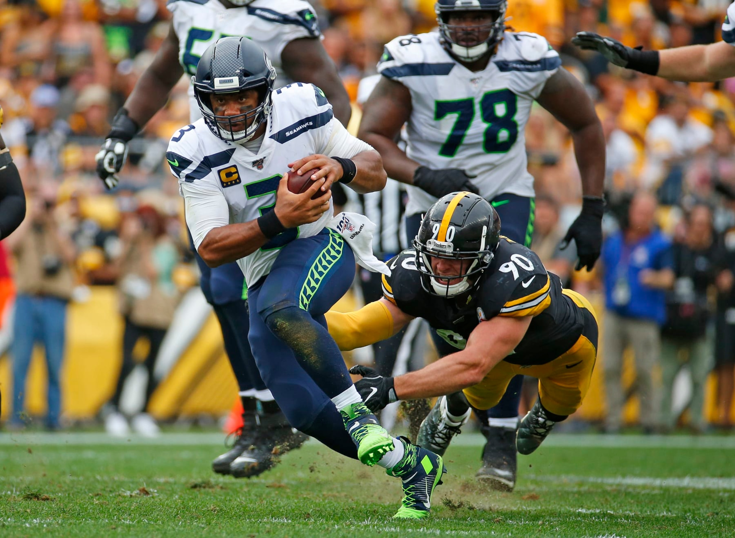PITTSBURGH, PA - SEPTEMBER 15:  Russell Wilson #3 of the Seattle Seahawks in action against T.J. Watt #90 of the Pittsburgh Steelers on September 15, 2019 at Heinz Field in Pittsburgh, Pennsylvania.  (Photo by Justin K. Aller/Getty Images)