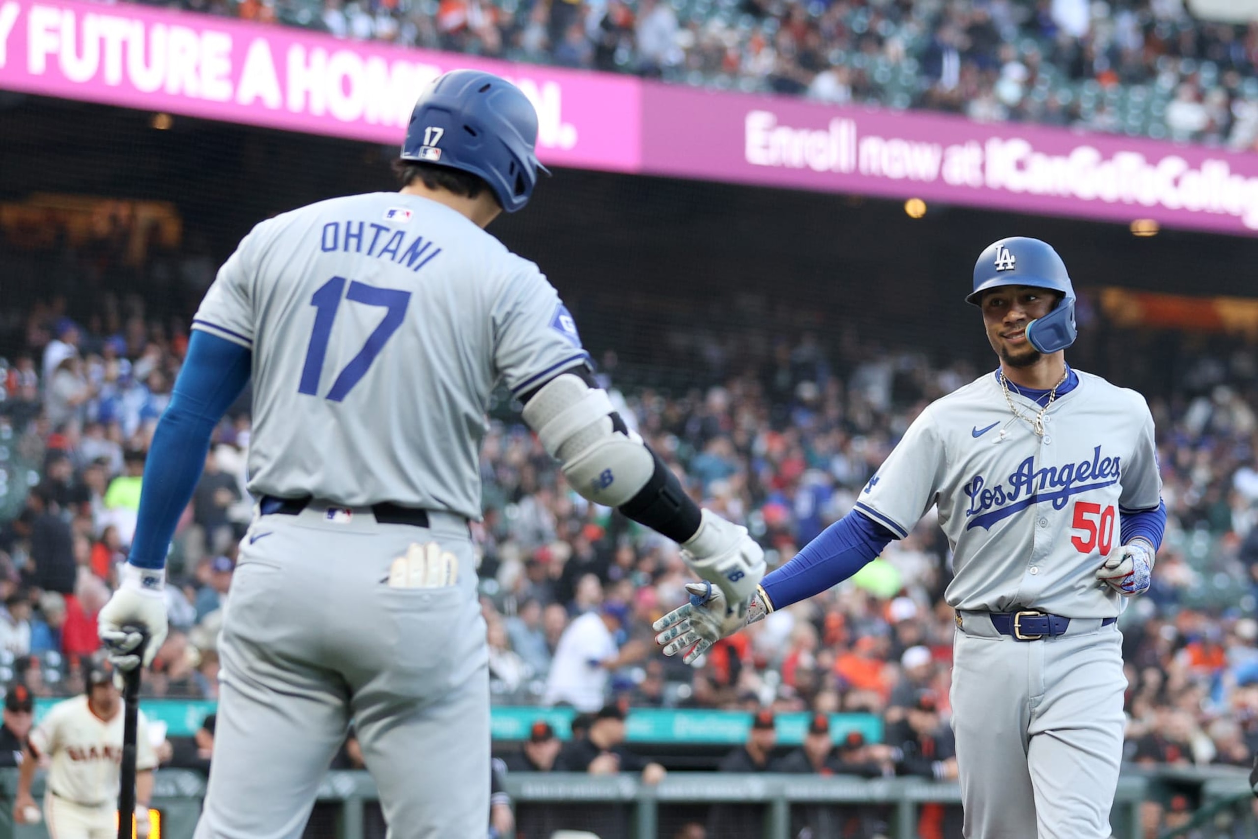 SAN FRANCISCO, CALIFORNIA - MAY 13: Mookie Betts #50 of the Los Angeles Dodgers is congratulated by Shohei Ohtani #17 after he hit a home run against the San Francisco Giants in the first inning at Oracle Park on May 13, 2024 in San Francisco, California. (Photo by Ezra Shaw/Getty Images)