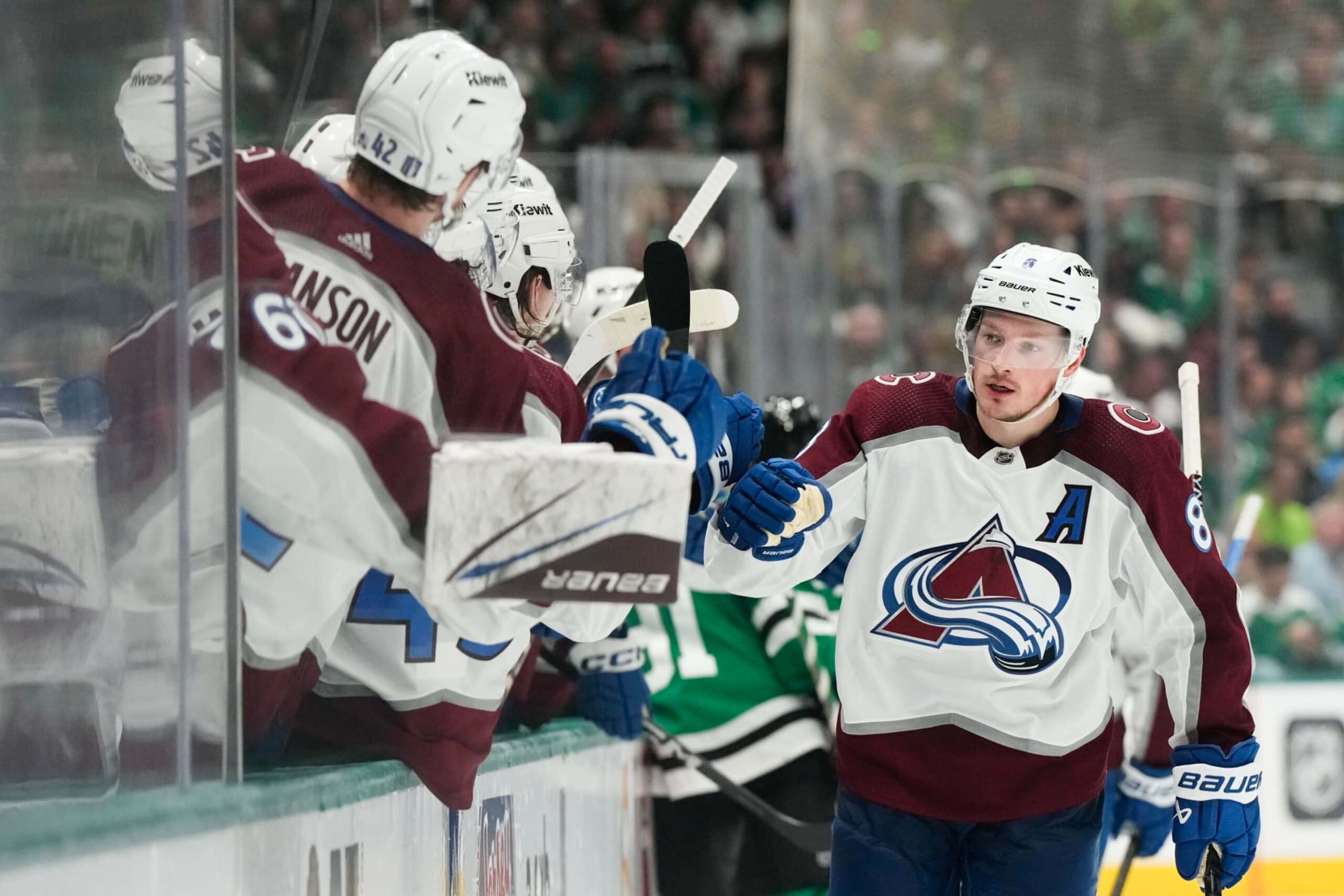 DALLAS, TEXAS - MAY 15: Cale Makar #8 of the Colorado Avalanche celebrates a goal against the Dallas Stars with teammates on the bench during the third period in Game Five of the Second Round of the 2024 Stanley Cup Playoffs at American Airlines Center on May 15, 2024 in Dallas, Texas. (Photo by Sam Hodde/Getty Images)