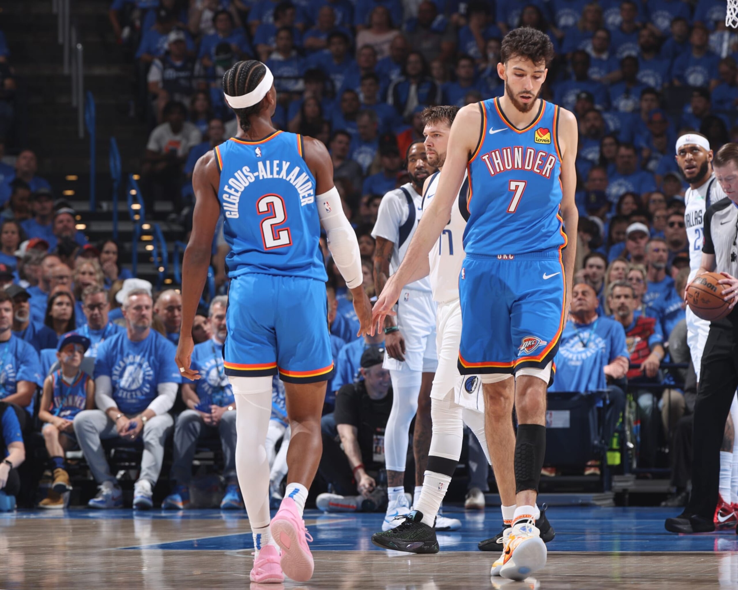 OKLAHOMA CITY, OK - MAY 9: Shai Gilgeous-Alexander #2 of the Oklahoma City Thunder & Chet Holmgren #7 of the Oklahoma City Thunder high five during the game against the Dallas Mavericks during Round 2 Game 2 of the 2024 NBA Playoffs on May 9, 2024 at Paycom Arena in Oklahoma City, Oklahoma. NOTE TO USER: User expressly acknowledges and agrees that, by downloading and or using this photograph, User is consenting to the terms and conditions of the Getty Images License Agreement. Mandatory Copyright Notice: Copyright 2024 NBAE (Photo by Joe Murphy/NBAE via Getty Images) OKLAHOMA CITY, OK - MAY 9: Shai Gilgeous-Alexander #2 of the Oklahoma City Thunder & Chet Holmgren #7 of the Oklahoma City Thunder high five during the game against the Dallas Mavericks during Round 2 Game 2 of the 2024 NBA Playoffs on May 9, 2024 at Paycom Arena in Oklahoma City, Oklahoma. NOTE TO USER: User expressly acknowledges and agrees that, by downloading and or using this photograph, User is consenting to the terms and conditions of the Getty Images License Agreement. Mandatory Copyright Notice: Copyright 2024 NBAE (Photo by Joe Murphy/NBAE via Getty Images)