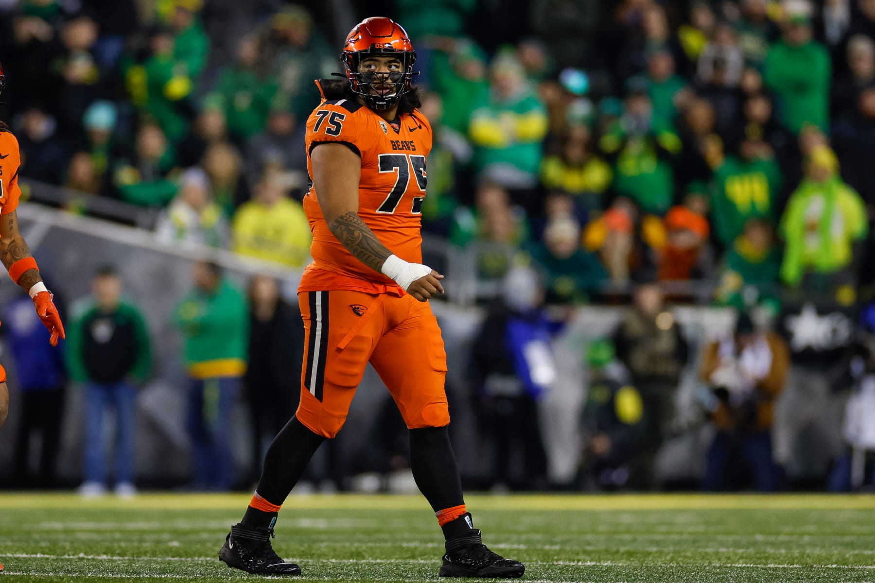 EUGENE, OREGON - NOVEMBER 24: Taliese Fuaga #75 of the Oregon State Beavers in an offensive position during a game against the Oregon Ducks at Autzen Stadium on November 24, 2023 in Eugene, Oregon. (Photo by Brandon Sloter/Image Of Sport/Getty Images)