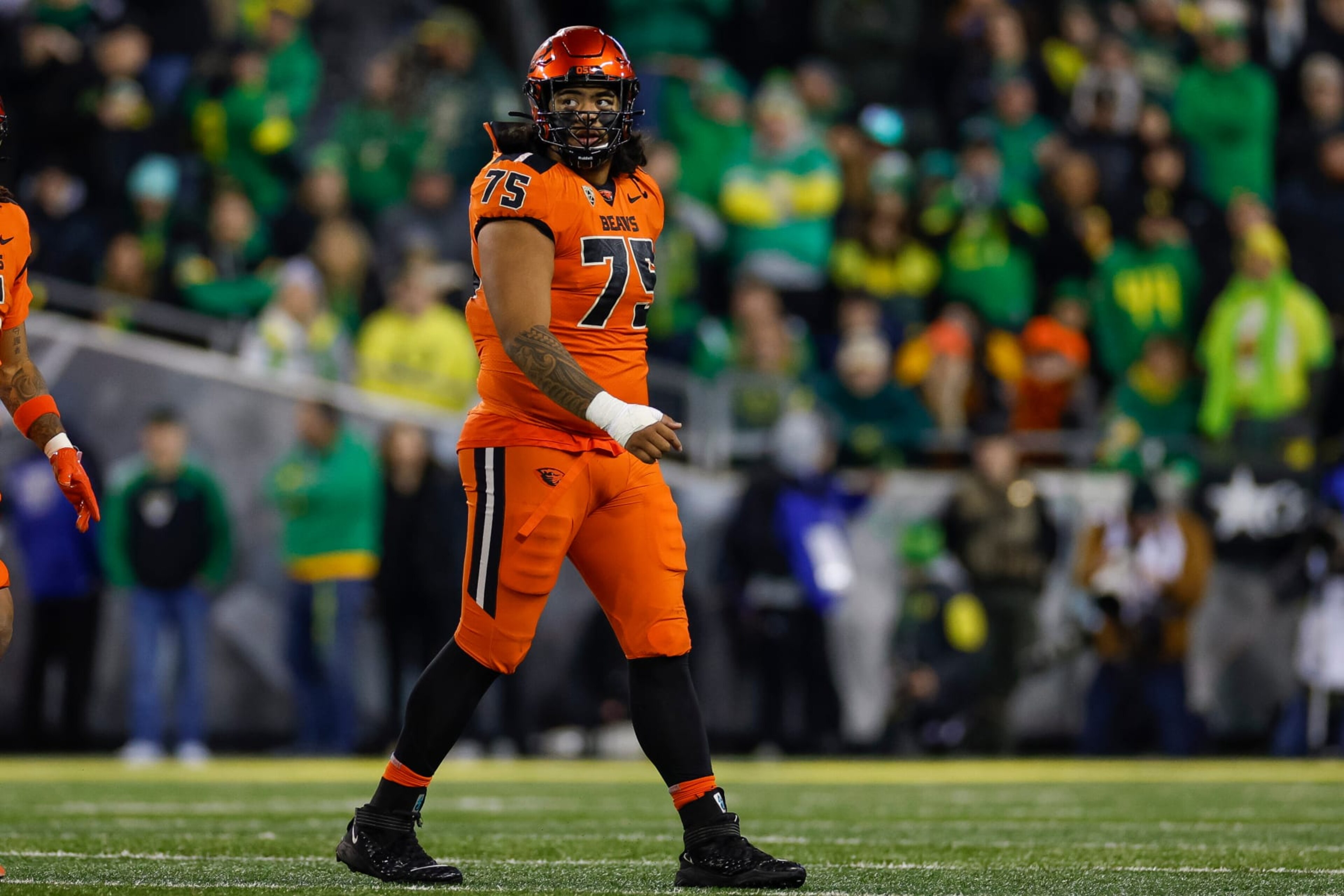 EUGENE, OREGON - NOVEMBER 24: Taliese Fuaga #75 of the Oregon State Beavers in an offensive position during a game against the Oregon Ducks at Autzen Stadium on November 24, 2023 in Eugene, Oregon. (Photo by Brandon Sloter/Image Of Sport/Getty Images)