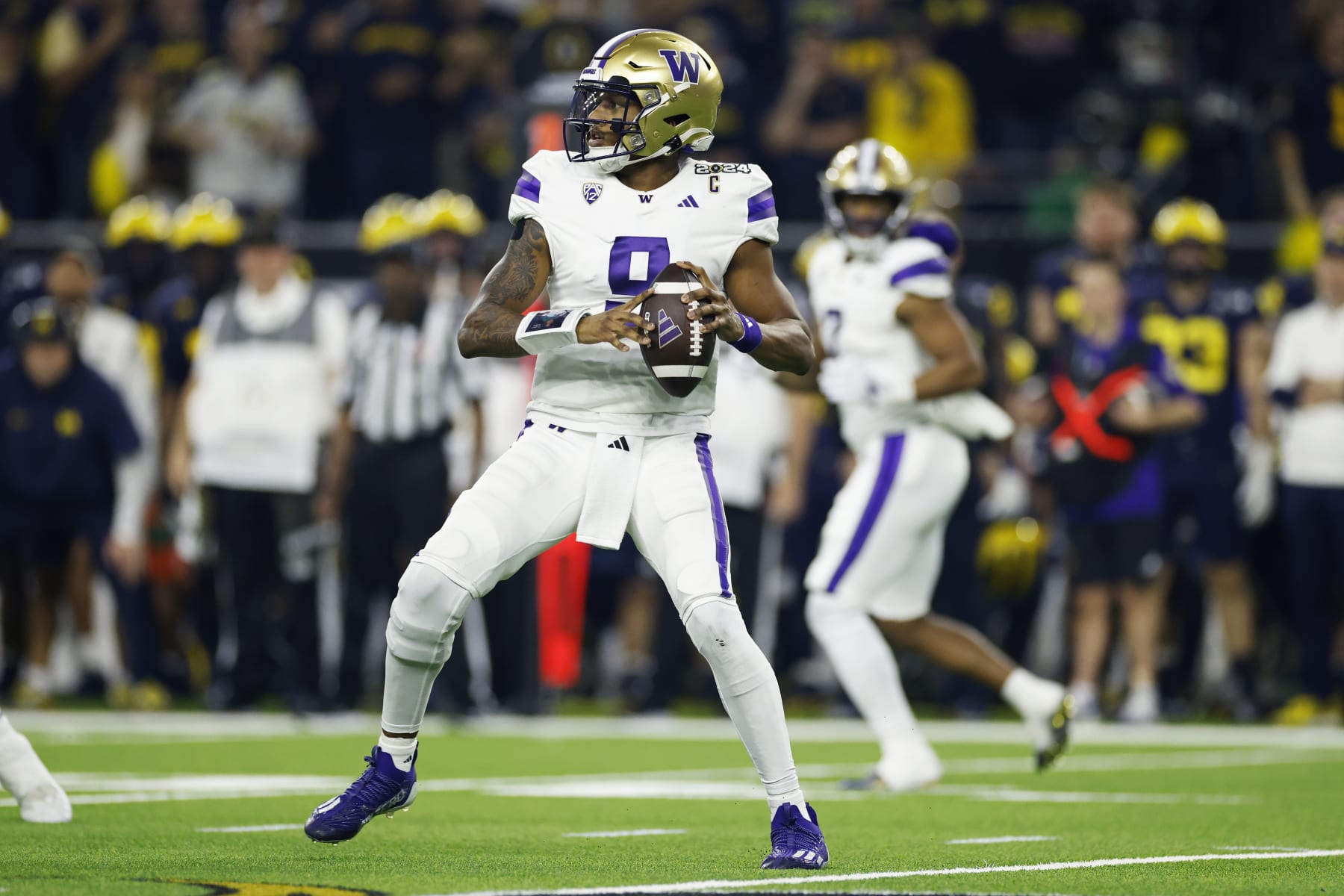 HOUSTON, TX - JANUARY 08: Washington Huskies quarterback Michael Penix Jr. (9) passes the ball during the CFP National Championship against the Michigan Wolverines on January 08, 2024 at NRG Stadium in Houston, Texas. (Photo by Joe Robbins/Icon Sportswire via Getty Images)