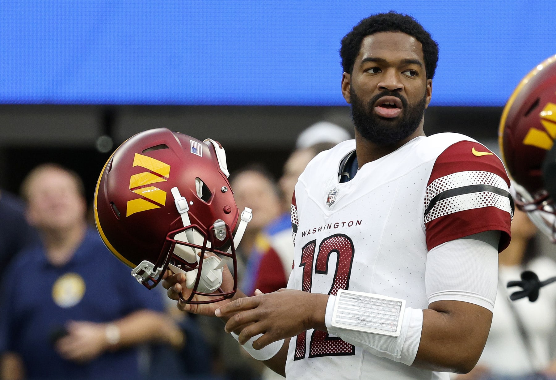 INGLEWOOD, CALIFORNIA - DECEMBER 17: Jacoby Brissett #12 of the Washington Commanders looks on before the game against the Los Angeles Rams at SoFi Stadium on December 17, 2023 in Inglewood, California. (Photo by Kevork Djansezian/Getty Images)