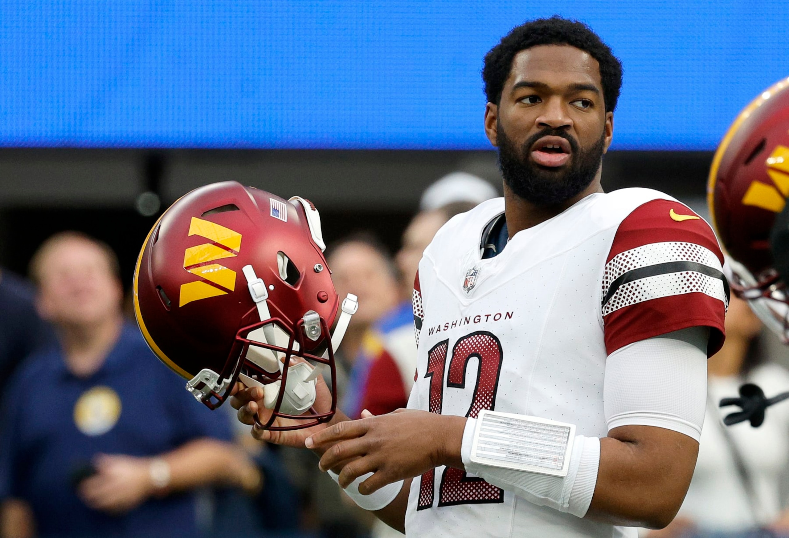 INGLEWOOD, CALIFORNIA - DECEMBER 17: Jacoby Brissett #12 of the Washington Commanders looks on before the game against the Los Angeles Rams at SoFi Stadium on December 17, 2023 in Inglewood, California. (Photo by Kevork Djansezian/Getty Images)