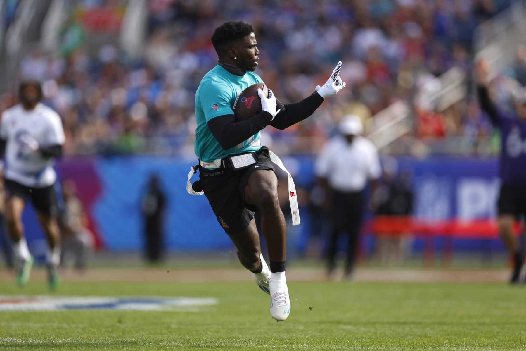 ORLANDO, FLORIDA - FEBRUARY 04: Tyreek Hill #10 of the Miami Dolphins and AFC reacts as he runs the ball for a touchdown during the first quarter of the 2024 NFL Pro Bowl Games at Camping World Stadium on February 04, 2024 in Orlando, Florida. (Photo by Mike Ehrmann/Getty Images)