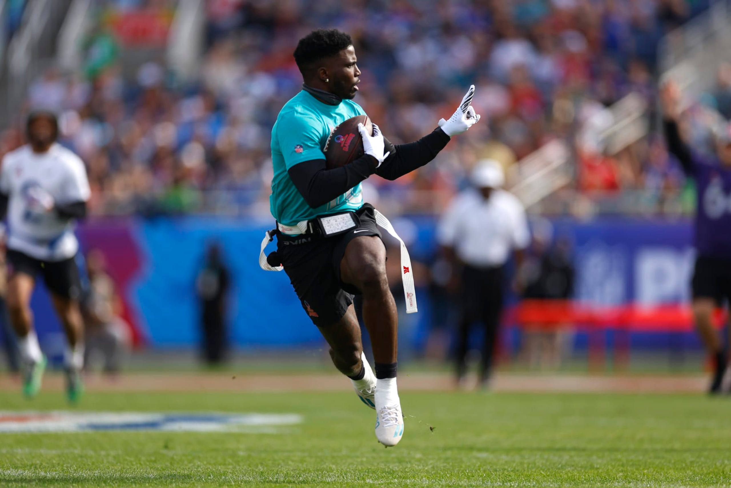 ORLANDO, FLORIDA - FEBRUARY 04: Tyreek Hill #10 of the Miami Dolphins and AFC reacts as he runs the ball for a touchdown during the first quarter of the 2024 NFL Pro Bowl Games at Camping World Stadium on February 04, 2024 in Orlando, Florida. (Photo by Mike Ehrmann/Getty Images) ORLANDO, FLORIDA - FEBRUARY 04: Tyreek Hill #10 of the Miami Dolphins and AFC reacts as he runs the ball for a touchdown during the first quarter of the 2024 NFL Pro Bowl Games at Camping World Stadium on February 04, 2024 in Orlando, Florida. (Photo by Mike Ehrmann/Getty Images)