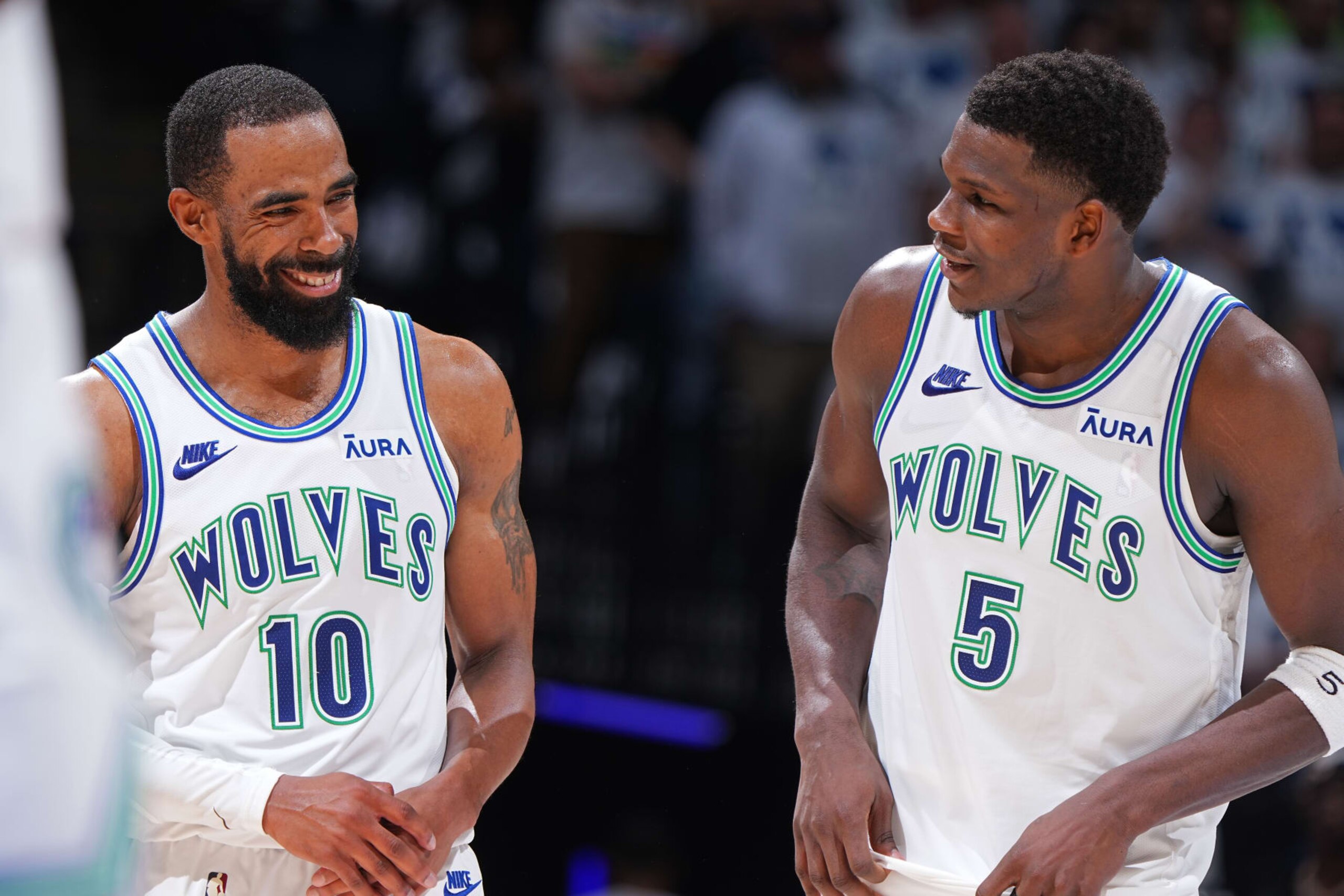 MINNEAPOLIS, MN - MAY 16: Mike Conley #10 and Anthony Edwards #5 of the Minnesota Timberwolves smile during the game against the Denver Nuggets during Round 2 Game 6 of the 2024 NBA Playoffs on May 16, 2024 at Target Center in Minneapolis, Minnesota. NOTE TO USER: User expressly acknowledges and agrees that, by downloading and or using this Photograph, user is consenting to the terms and conditions of the Getty Images License Agreement. Mandatory Copyright Notice: Copyright 2024 NBAE (Photo by Garrett Ellwood/NBAE via Getty Images) MINNEAPOLIS, MN - MAY 16: Mike Conley #10 and Anthony Edwards #5 of the Minnesota Timberwolves smile during the game against the Denver Nuggets during Round 2 Game 6 of the 2024 NBA Playoffs on May 16, 2024 at Target Center in Minneapolis, Minnesota. NOTE TO USER: User expressly acknowledges and agrees that, by downloading and or using this Photograph, user is consenting to the terms and conditions of the Getty Images License Agreement. Mandatory Copyright Notice: Copyright 2024 NBAE (Photo by Garrett Ellwood/NBAE via Getty Images)