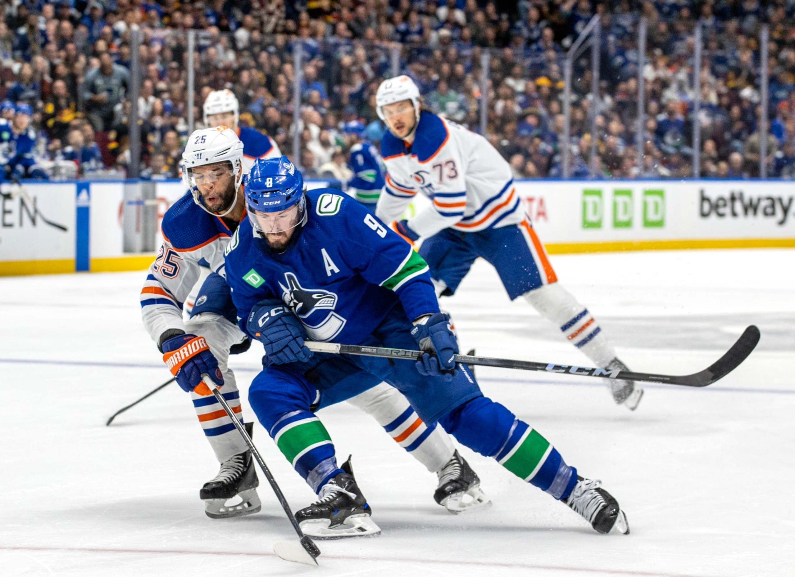 VANCOUVER, CANADA - MAY 16: J.T. Miller #9 of the Vancouver Canucks and Darnell Nurse #25 of the Edmonton Oilers battle for the puck during the first period in Game Five of the Second Round of the 2024 Stanley Cup Playoffs at Rogers Arena on May 16, 2024 in Vancouver, British Columbia, Canada. (Photo by Jeff Vinnick/NHLI via Getty Images) VANCOUVER, CANADA - MAY 16: J.T. Miller #9 of the Vancouver Canucks and Darnell Nurse #25 of the Edmonton Oilers battle for the puck during the first period in Game Five of the Second Round of the 2024 Stanley Cup Playoffs at Rogers Arena on May 16, 2024 in Vancouver, British Columbia, Canada. (Photo by Jeff Vinnick/NHLI via Getty Images)