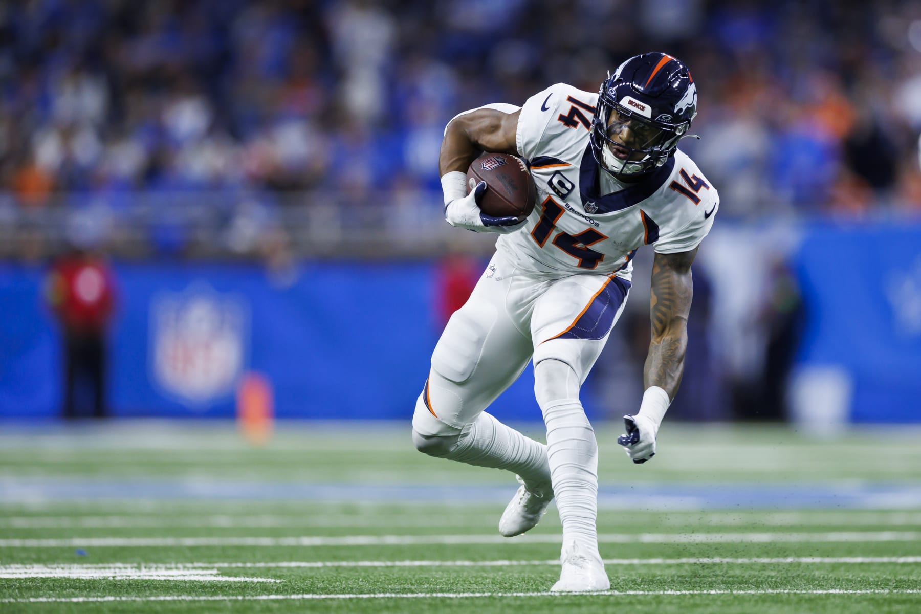 DETROIT, MICHIGAN - DECEMBER 16: Courtland Sutton #14 of the Denver Broncos runs the ball after a catch during an NFL football game against the Detroit Lions at Ford Field on December 16, 2023 in Detroit, Michigan. (Photo by Ryan Kang/Getty Images)