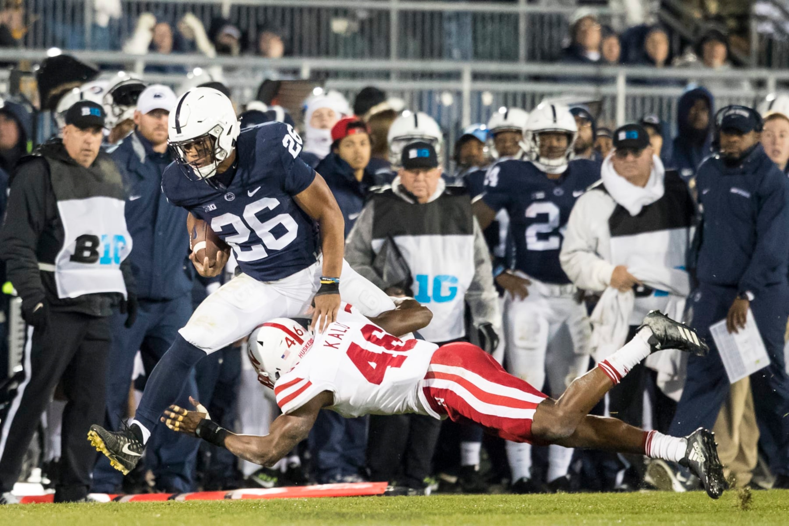 UNIVERSITY PARK, PA - NOVEMBER 18:  Saquon Barkley #26 of the Penn State Nittany Lions is forced out of bounds by Joshua Kalu #46 of the Nebraska Cornhuskers on November 18, 2017 at Beaver Stadium in University Park, Pennsylvania.  (Photo by Brett Carlsen/Getty Images)