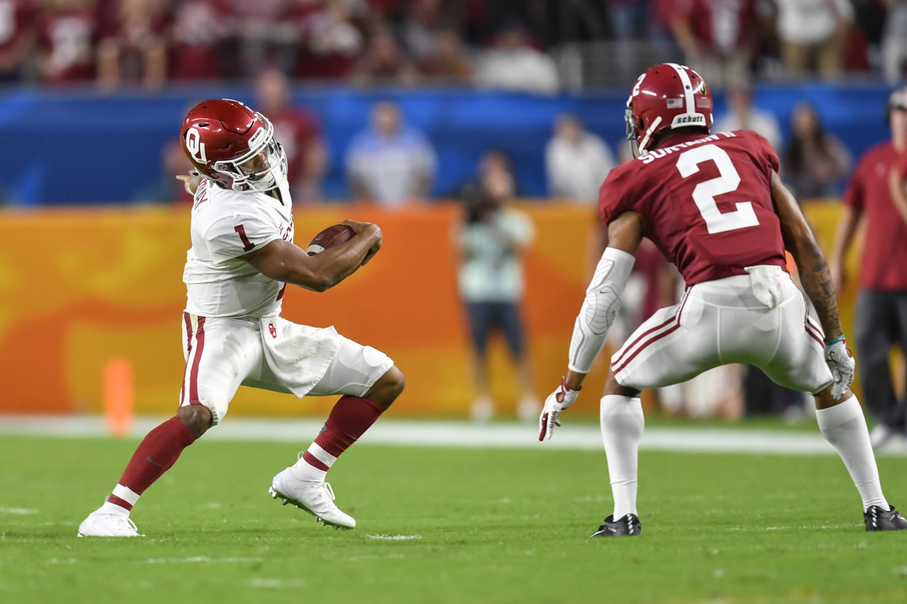 MIAMI GARDENS, FL - DECEMBER 29: Oklahoma quarterback Kyler Murray (1) tries to evade Alabama defensive back Patrick Surtain II (2) during the first half of the CFP Semifinal at the Orange Bowl between Alabama Crimson Tide and the Oklahoma Sooners on December 29, 2018, at Hard Rock Stadium in Miami Gardens, FL. (Photo by Roy K. Miller/Icon Sportswire via Getty Images)