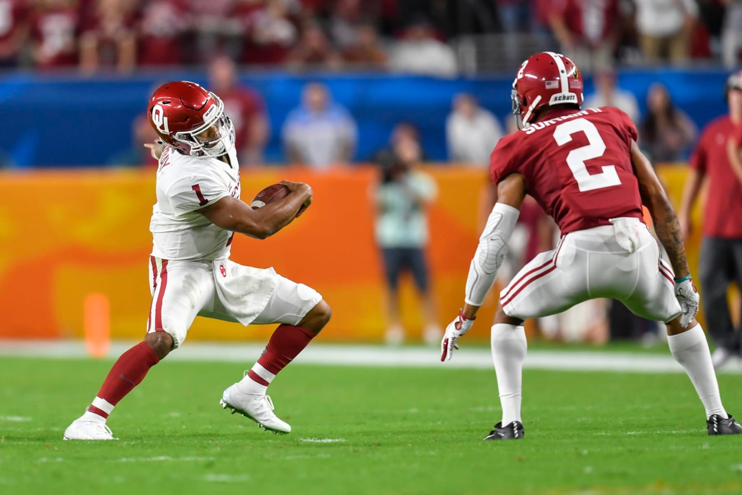 MIAMI GARDENS, FL - DECEMBER 29: Oklahoma quarterback Kyler Murray (1) tries to evade Alabama defensive back Patrick Surtain II (2) during the first half of the CFP Semifinal at the Orange Bowl between Alabama Crimson Tide and the Oklahoma Sooners on December 29, 2018, at Hard Rock Stadium in Miami Gardens, FL. (Photo by Roy K. Miller/Icon Sportswire via Getty Images)
