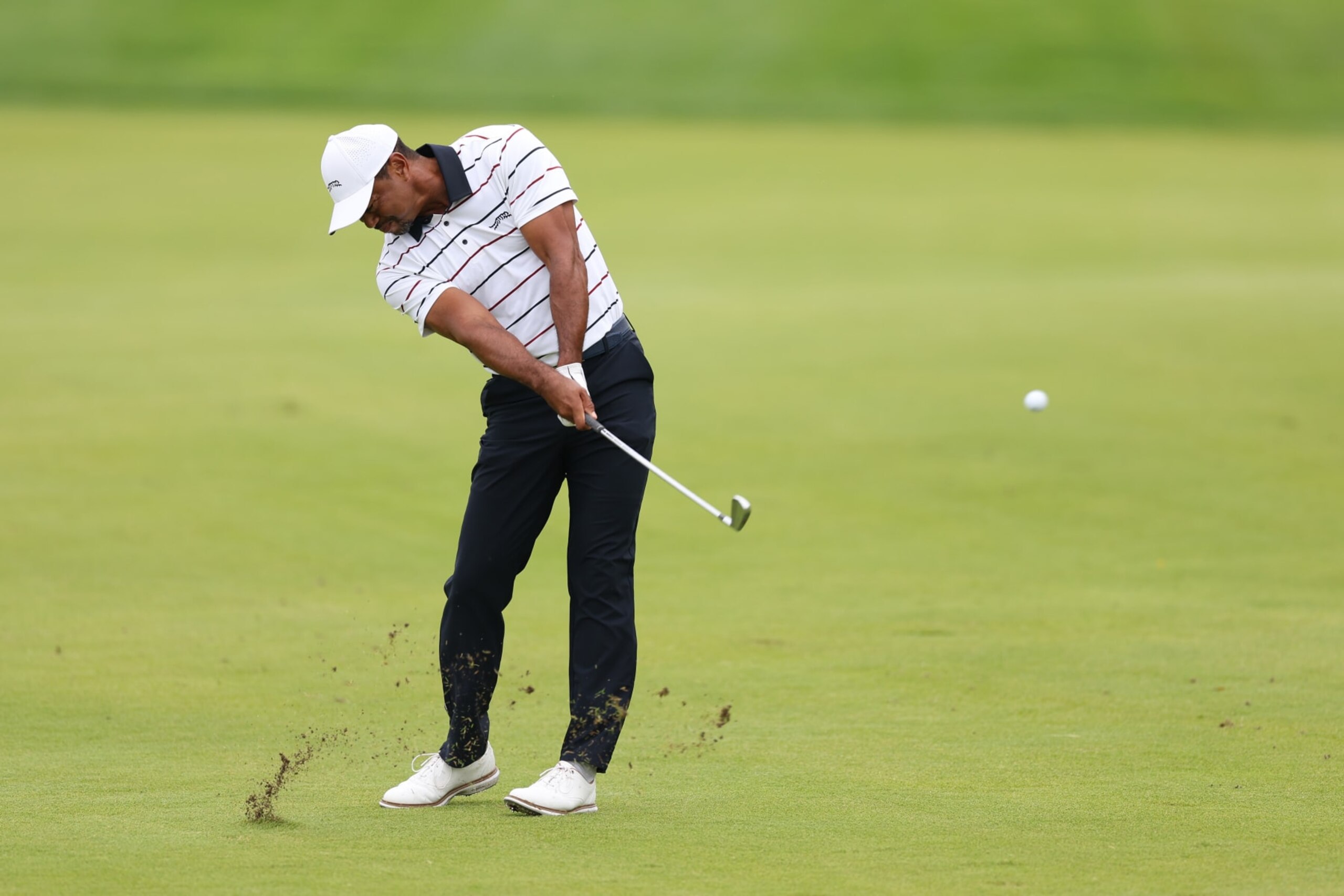 LOUISVILLE, KENTUCKY - MAY 17: Tiger Woods of the United States plays an approach shot on the first hole during the second round of the 2024 PGA Championship at Valhalla Golf Club on May 17, 2024 in Louisville, Kentucky. (Photo by Christian Petersen/Getty Images)
