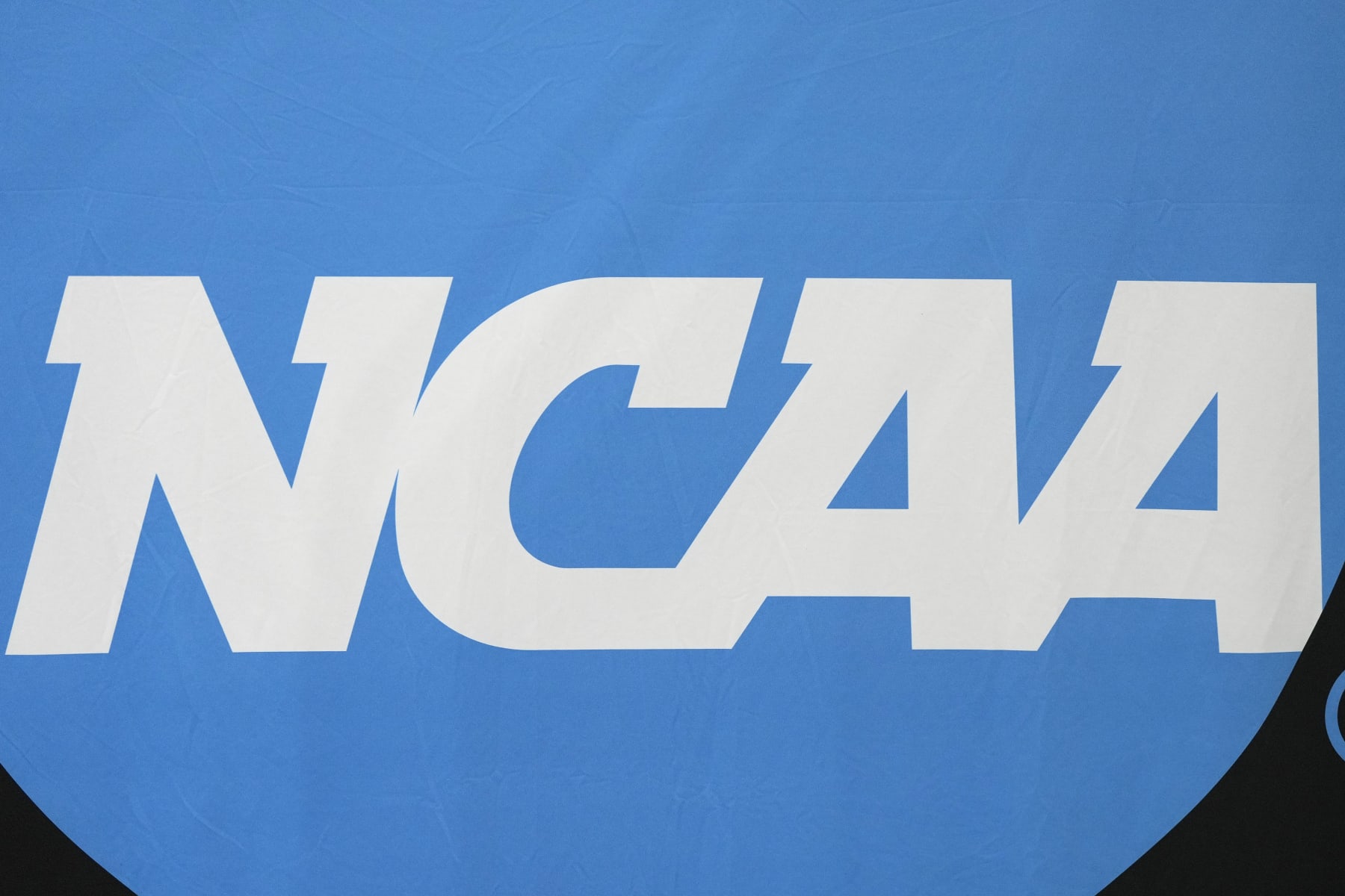 GLENDALE, ARIZONA - APRIL 08:  The NCAA logo on the wall before the National Championship game between the Purdue Boilermakers and the Connecticut Huskies at State Farm Stadium on April 08, 2024 in Glendale, Arizona.  (Photo by Mitchell Layton/Getty Images)