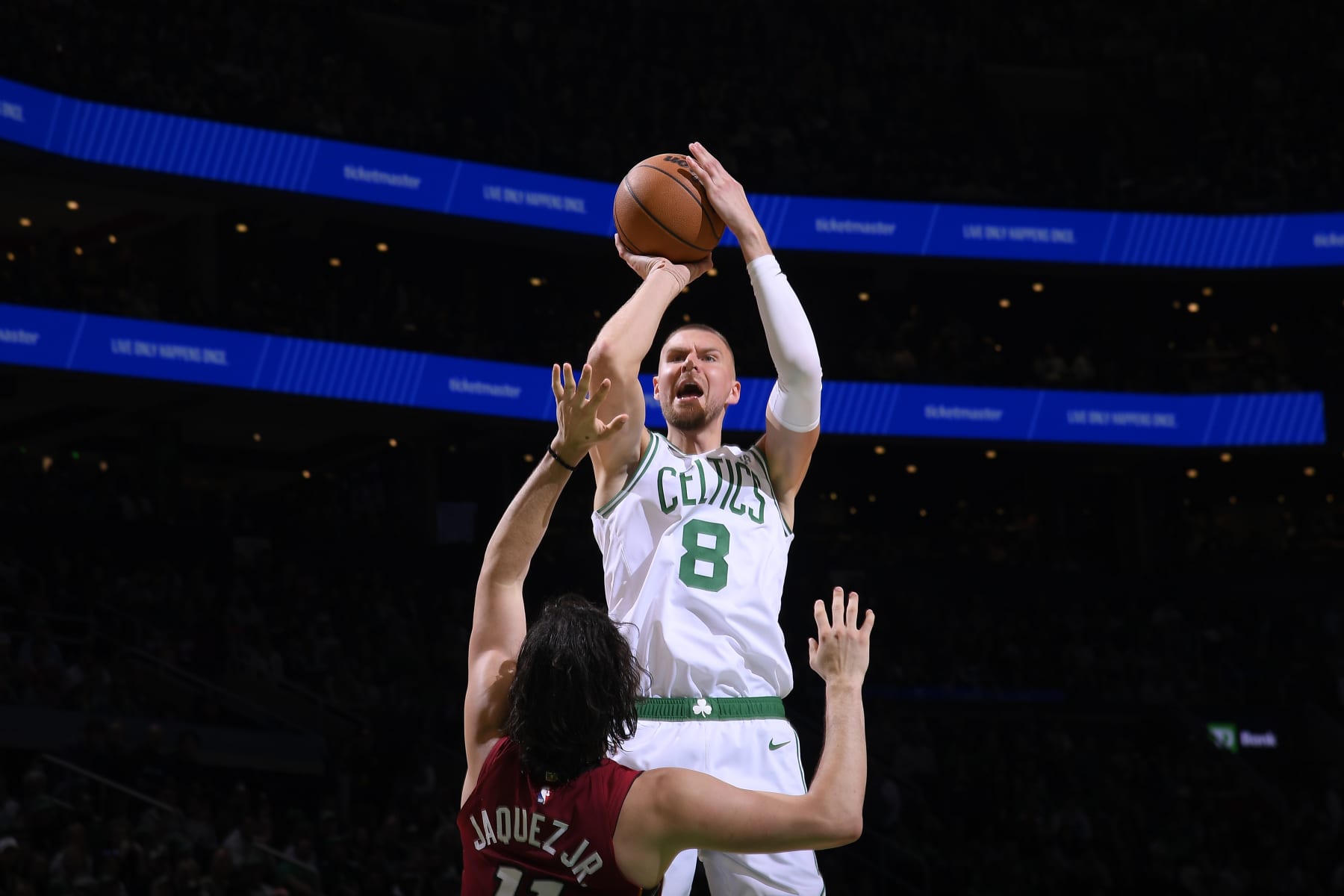 BOSTON, MA - APRIL 21: Kristaps Porzingis #8 of the Boston Celtics shoots a three point basket against the Miami Heat during Round 1 Game 1 of the 2024 NBA Playoffs on April 21, 2024 at the TD Garden in Boston, Massachusetts. NOTE TO USER: User expressly acknowledges and agrees that, by downloading and or using this photograph, User is consenting to the terms and conditions of the Getty Images License Agreement. Mandatory Copyright Notice: Copyright 2024 NBAE  (Photo by Brian Babineau/NBAE via Getty Images)