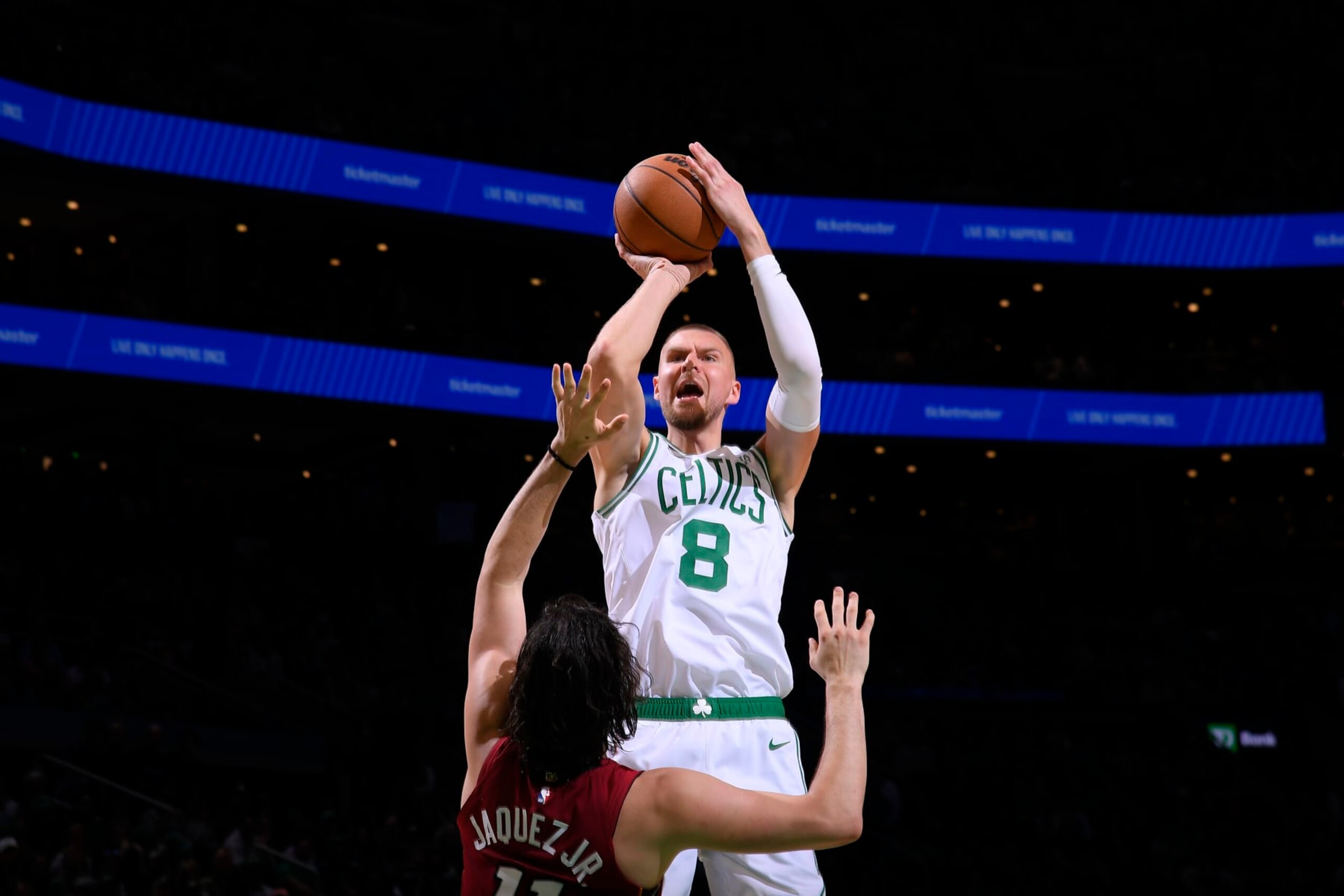 BOSTON, MA - APRIL 21: Kristaps Porzingis #8 of the Boston Celtics shoots a three point basket against the Miami Heat during Round 1 Game 1 of the 2024 NBA Playoffs on April 21, 2024 at the TD Garden in Boston, Massachusetts. NOTE TO USER: User expressly acknowledges and agrees that, by downloading and or using this photograph, User is consenting to the terms and conditions of the Getty Images License Agreement. Mandatory Copyright Notice: Copyright 2024 NBAE  (Photo by Brian Babineau/NBAE via Getty Images)