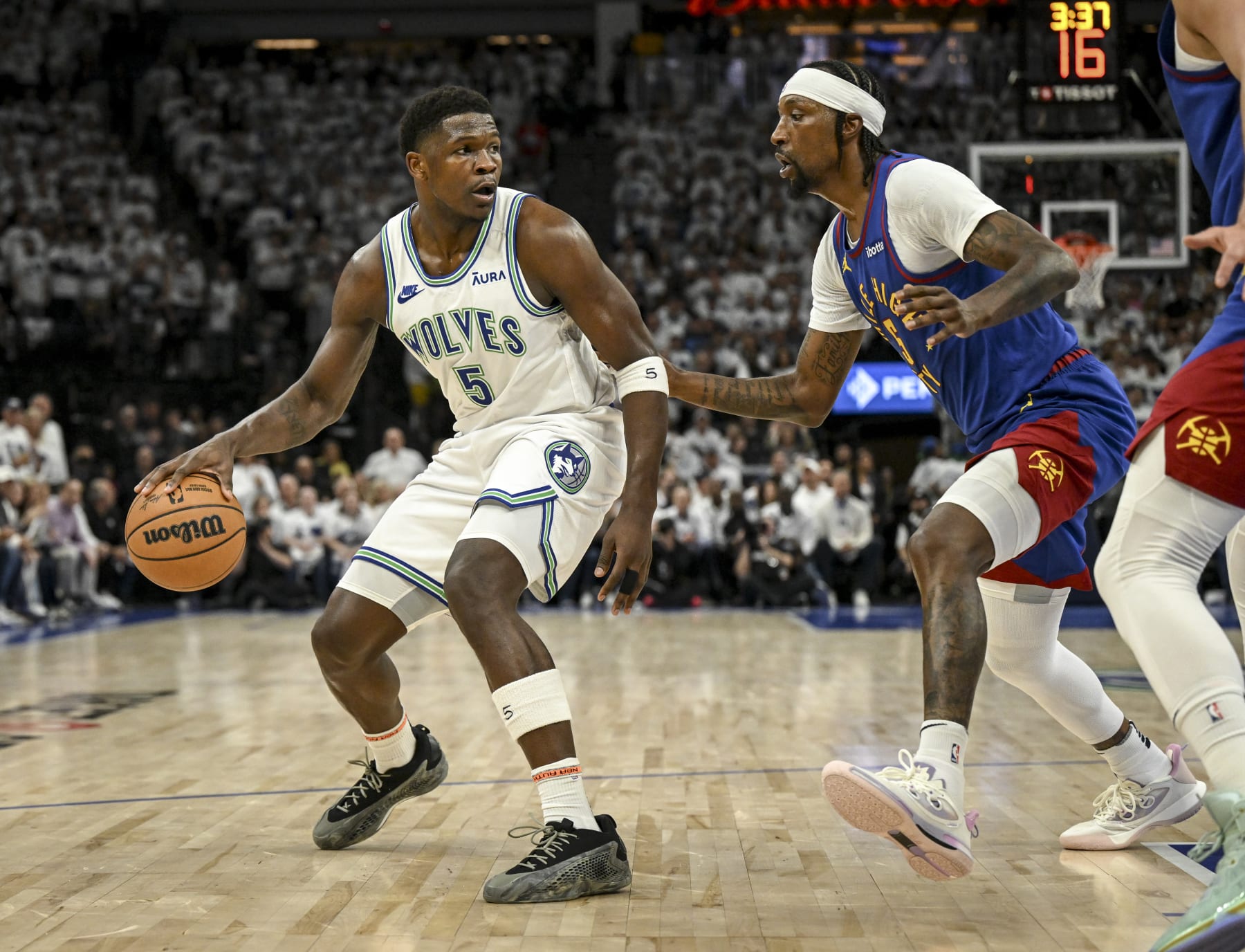 MINNEAPOLIS, MN - MAY 16: Kentavious Caldwell-Pope (5) of the Denver Nuggets defends Anthony Edwards (5) of the Minnesota Timberwolves during the first quarter at Target Center in Minneapolis on Thursday, May 16, 2024. (Photo by AAron Ontiveroz/The Denver Post)