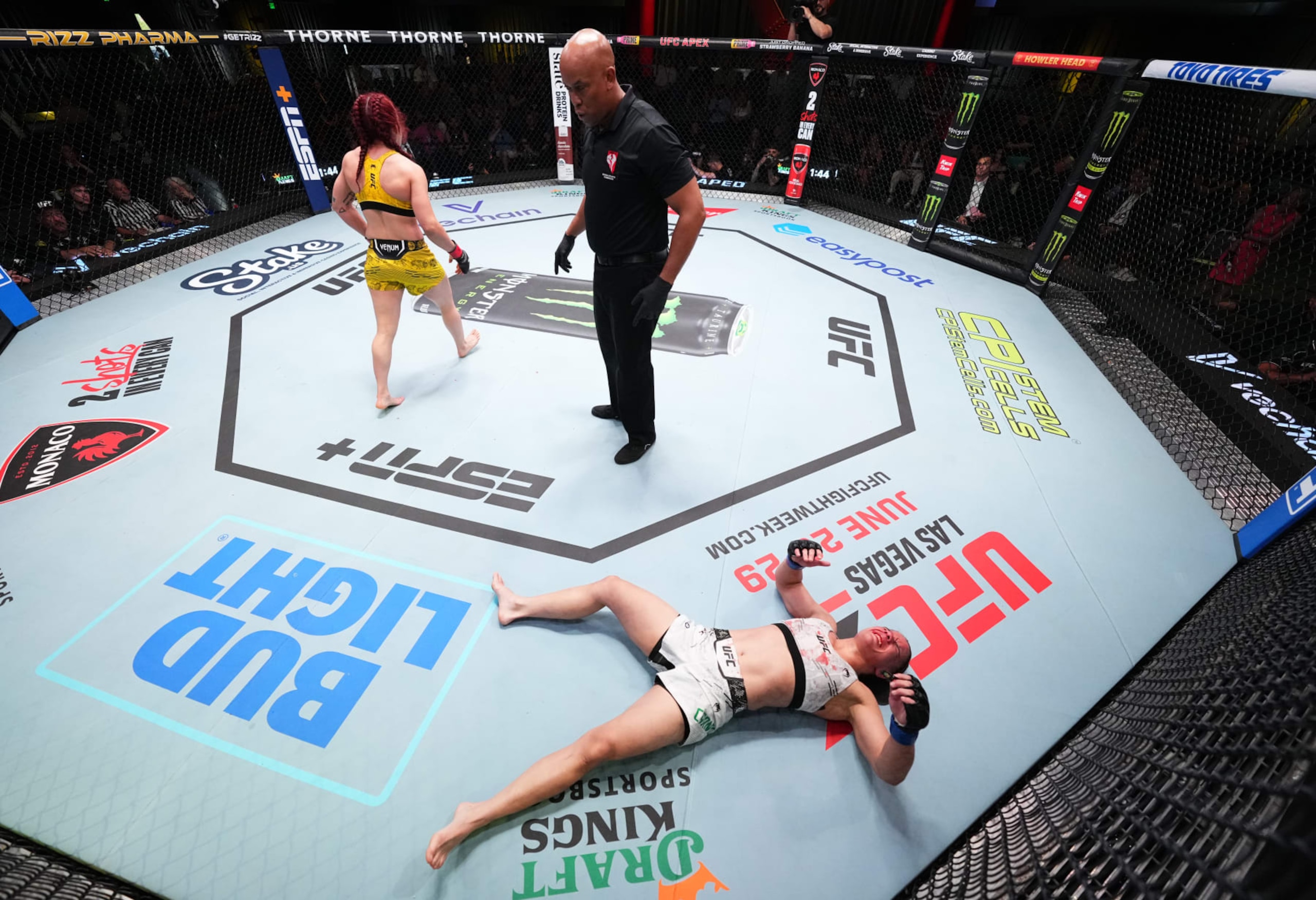 Ariane Carnelossi lays on the ground after an illegal headbutt from Piera Rodriguez 
