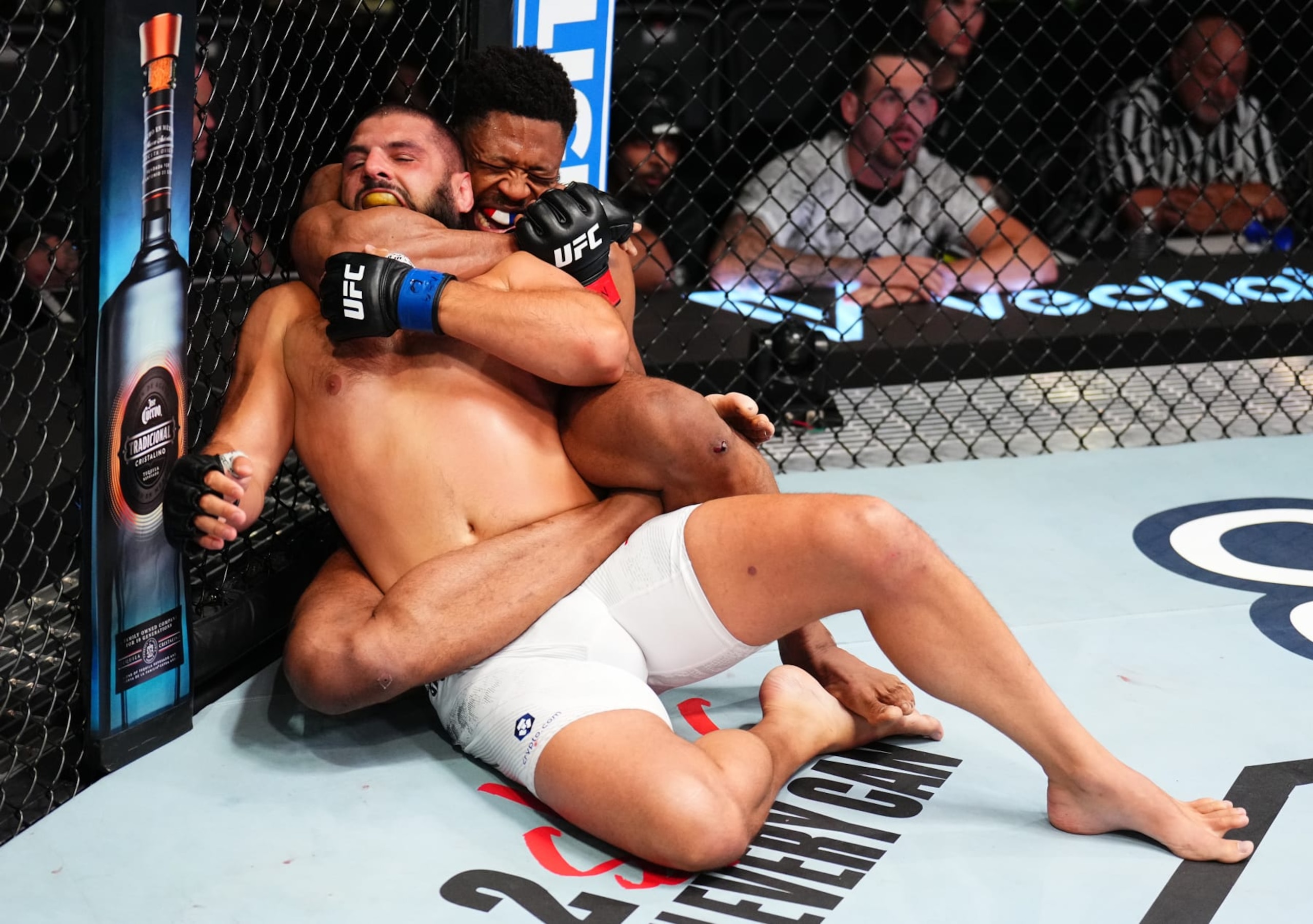 Oumar Sy secures a rear-naked choke submission against Tuco Tokkos