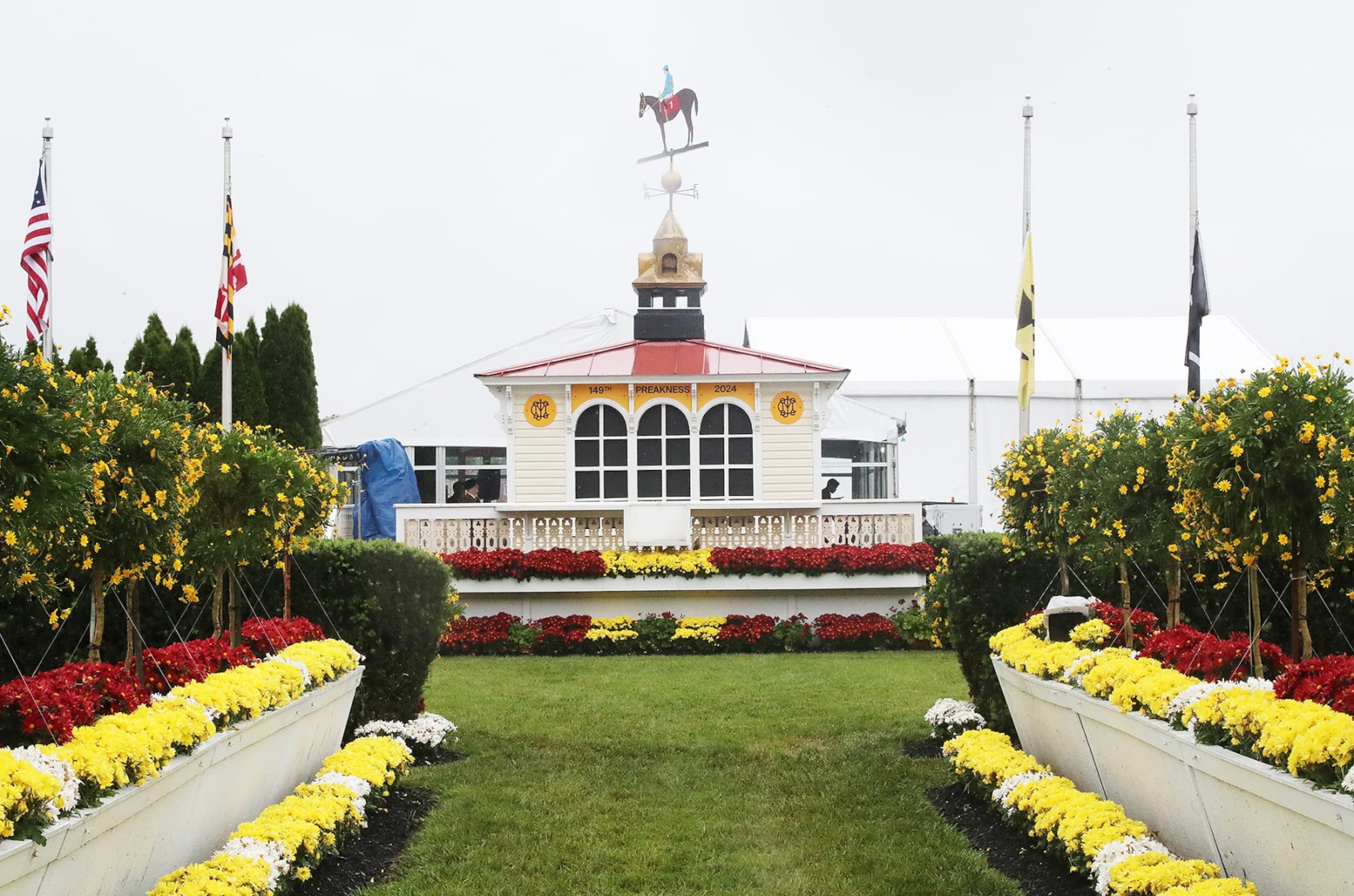 BALTIMORE, MD - MAY 18: Cupola and weathervane highlighted by yellow flowers on Preakness Day , Pimlico Race Course, on May 18, 2024 in  Baltimore, Maryland. (Photo by Horsephotos/Getty Images)