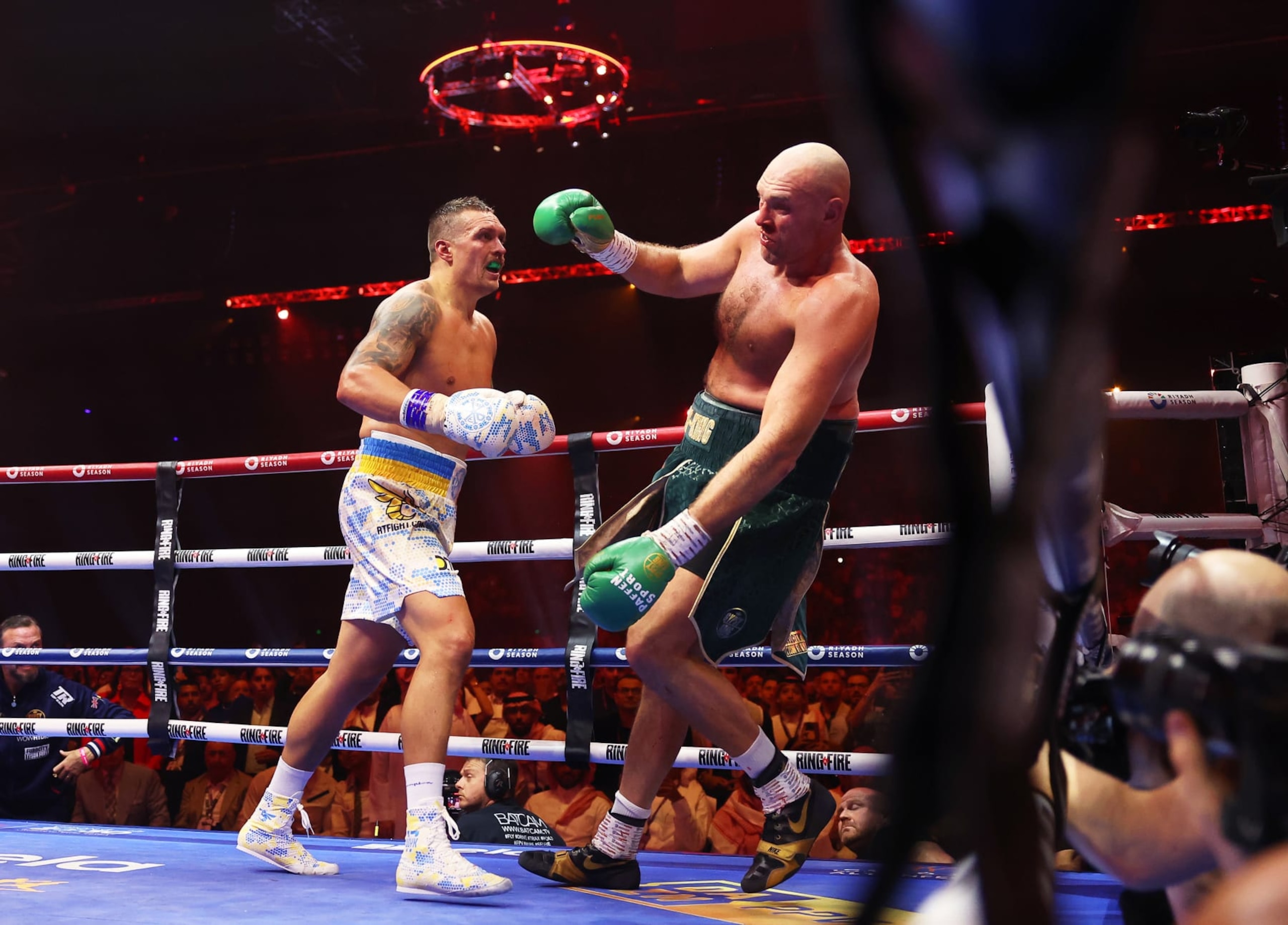 RIYADH, SAUDI ARABIA - MAY 18: Tyson Fury reacts after being punched by Oleksandr Usyk during the IBF, WBA, WBC, WBO and Undisputed Heavyweight titles' fight between Tyson Fury and Oleksandr Usyk at Kingdom Arena on May 18, 2024 in Riyadh, Saudi Arabia. (Photo by Richard Pelham/Getty Images)