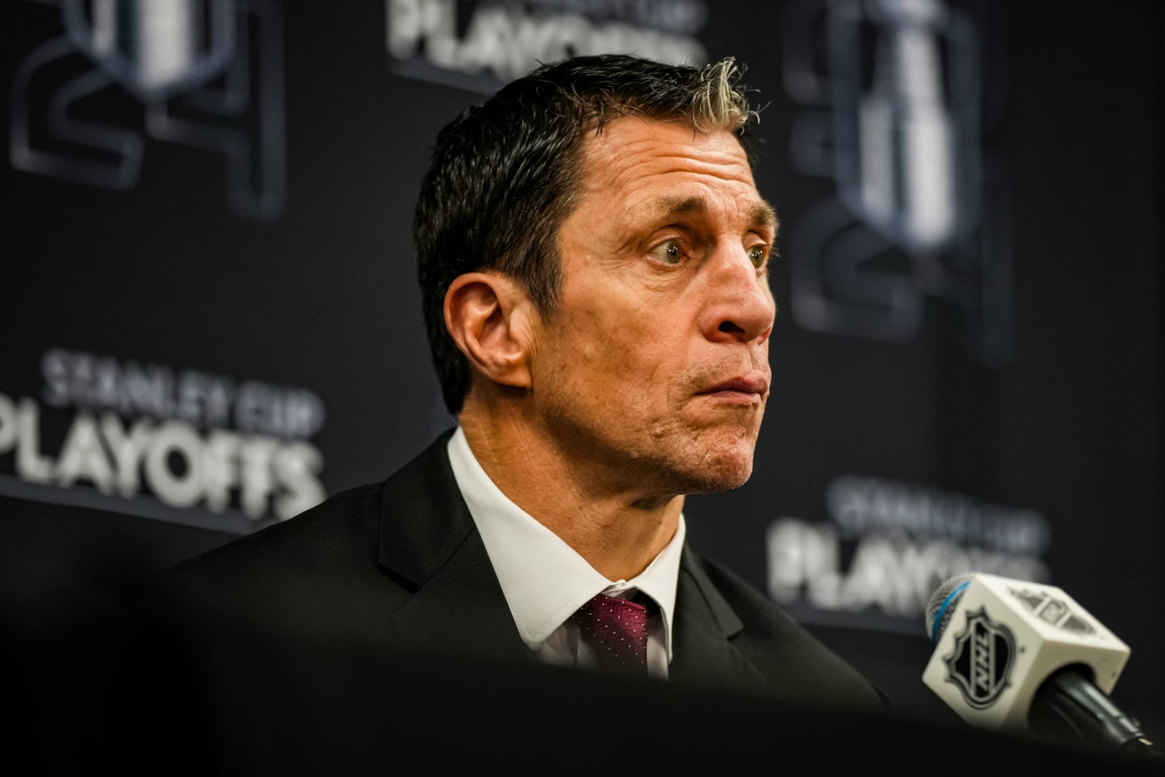 ELMONT, NEW YORK - APRIL 25: Head coach Rod Brind'Amour of the Carolina Hurricanes speaks with media after a 3-2 victory against the New York Islanders in Game Three of the First Round of the 2024 Stanley Cup Playoffs at UBS Arena on April 25, 2024 in Elmont, New York. (Photo by Josh Lavallee/NHLI via Getty Images) ELMONT, NEW YORK - APRIL 25: Head coach Rod Brind'Amour of the Carolina Hurricanes speaks with media after a 3-2 victory against the New York Islanders in Game Three of the First Round of the 2024 Stanley Cup Playoffs at UBS Arena on April 25, 2024 in Elmont, New York. (Photo by Josh Lavallee/NHLI via Getty Images)