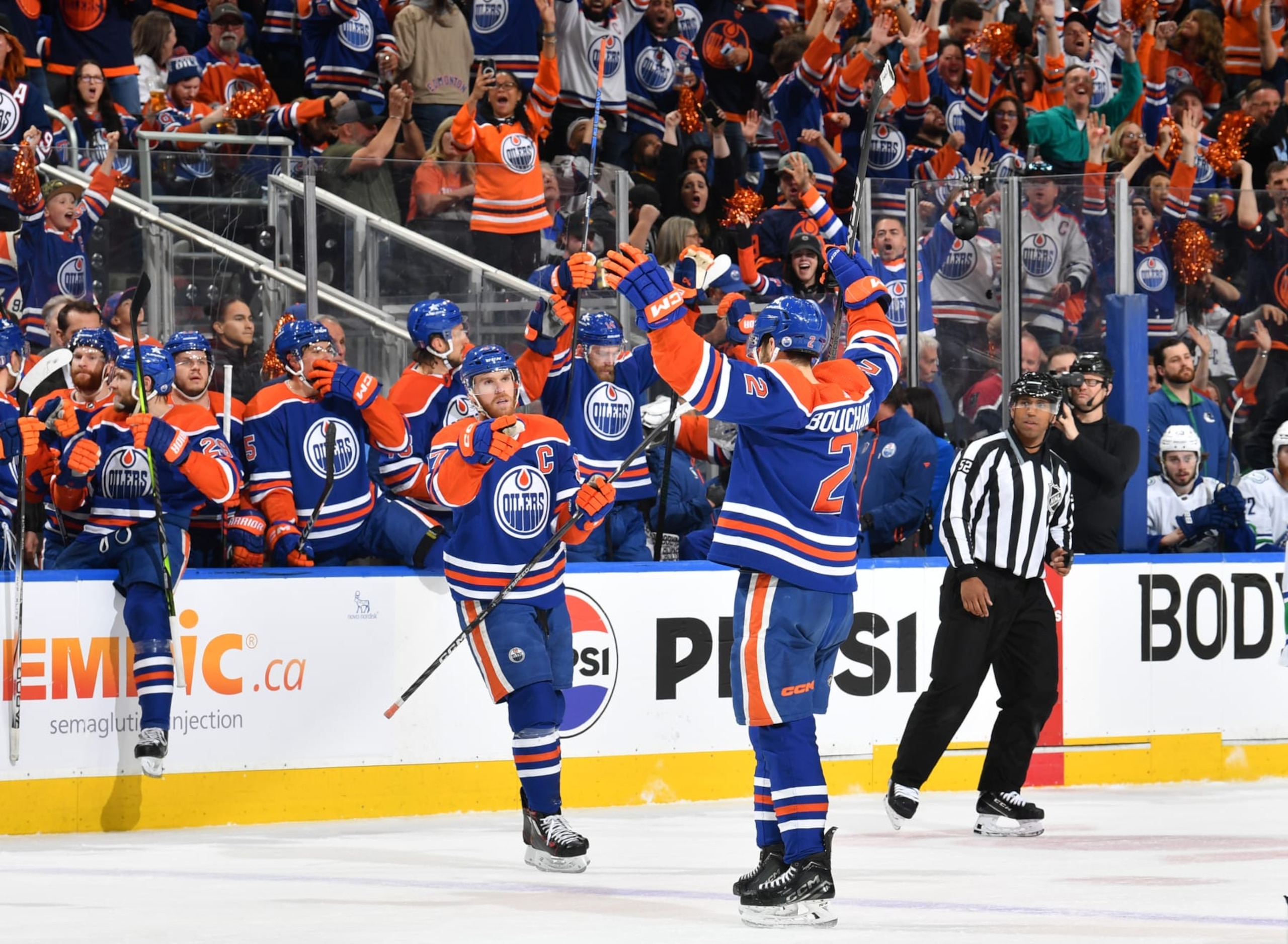 EDMONTON, CANADA - MAY 18: Evan Bouchard #2 of the Edmonton Oilers celebrates his second-period goal against the Vancouver Canucks with Connor McDavid #97 in Game Six of the Second Round of the 2024 Stanley Cup Playoffs at Rogers Place on May 18, 2024, in Edmonton, Alberta, Canada. (Photo by Andy Devlin/NHLI via Getty Images) EDMONTON, CANADA - MAY 18: Evan Bouchard #2 of the Edmonton Oilers celebrates his second-period goal against the Vancouver Canucks with Connor McDavid #97 in Game Six of the Second Round of the 2024 Stanley Cup Playoffs at Rogers Place on May 18, 2024, in Edmonton, Alberta, Canada. (Photo by Andy Devlin/NHLI via Getty Images)