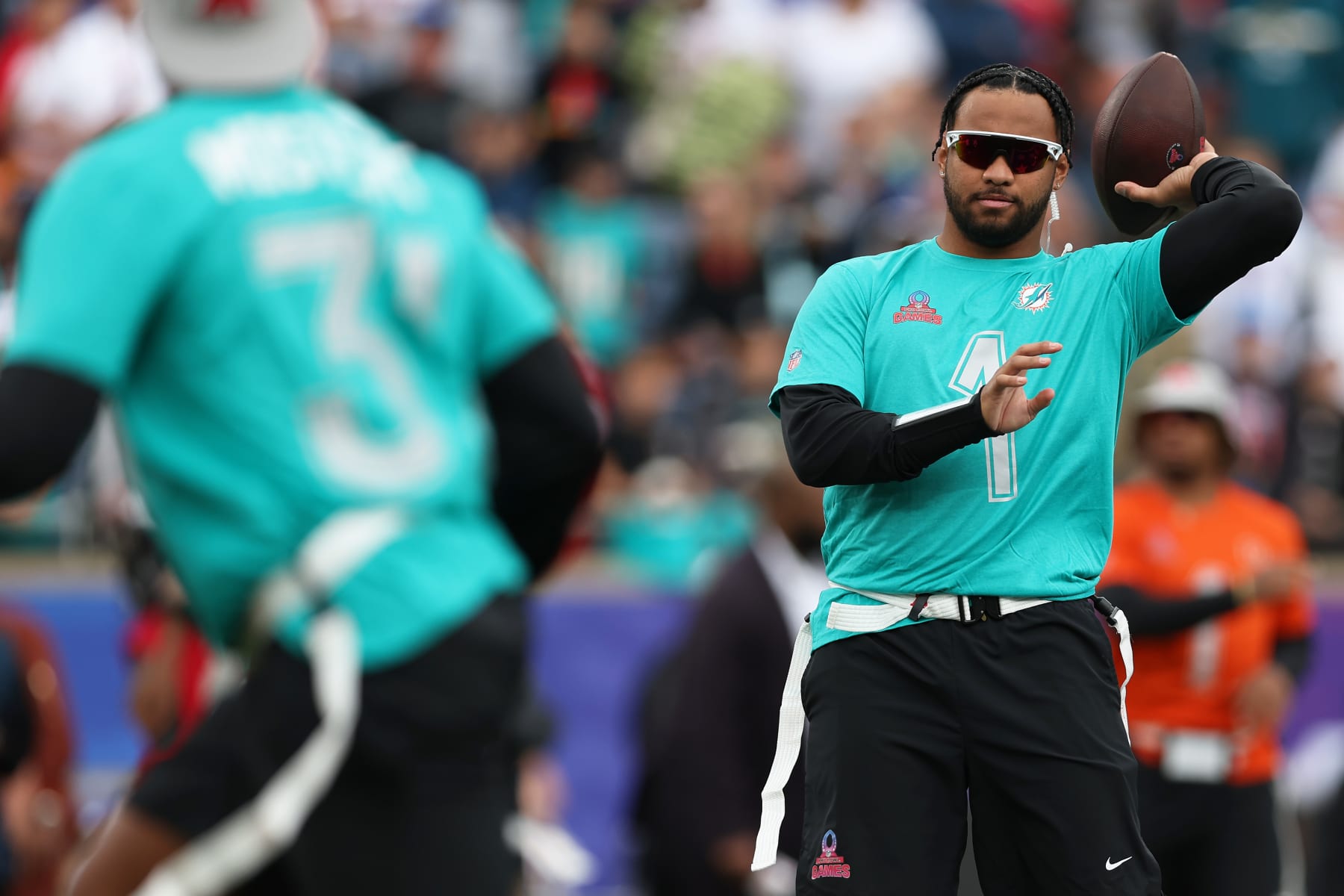 ORLANDO, FLORIDA - FEBRUARY 04: Tua Tagovailoa #1 of the Miami Dolphins and AFC warms-up prior to the 2024 NFL Pro Bowl Games at Camping World Stadium on February 04, 2024 in Orlando, Florida. (Photo by Megan Briggs/Getty Images)