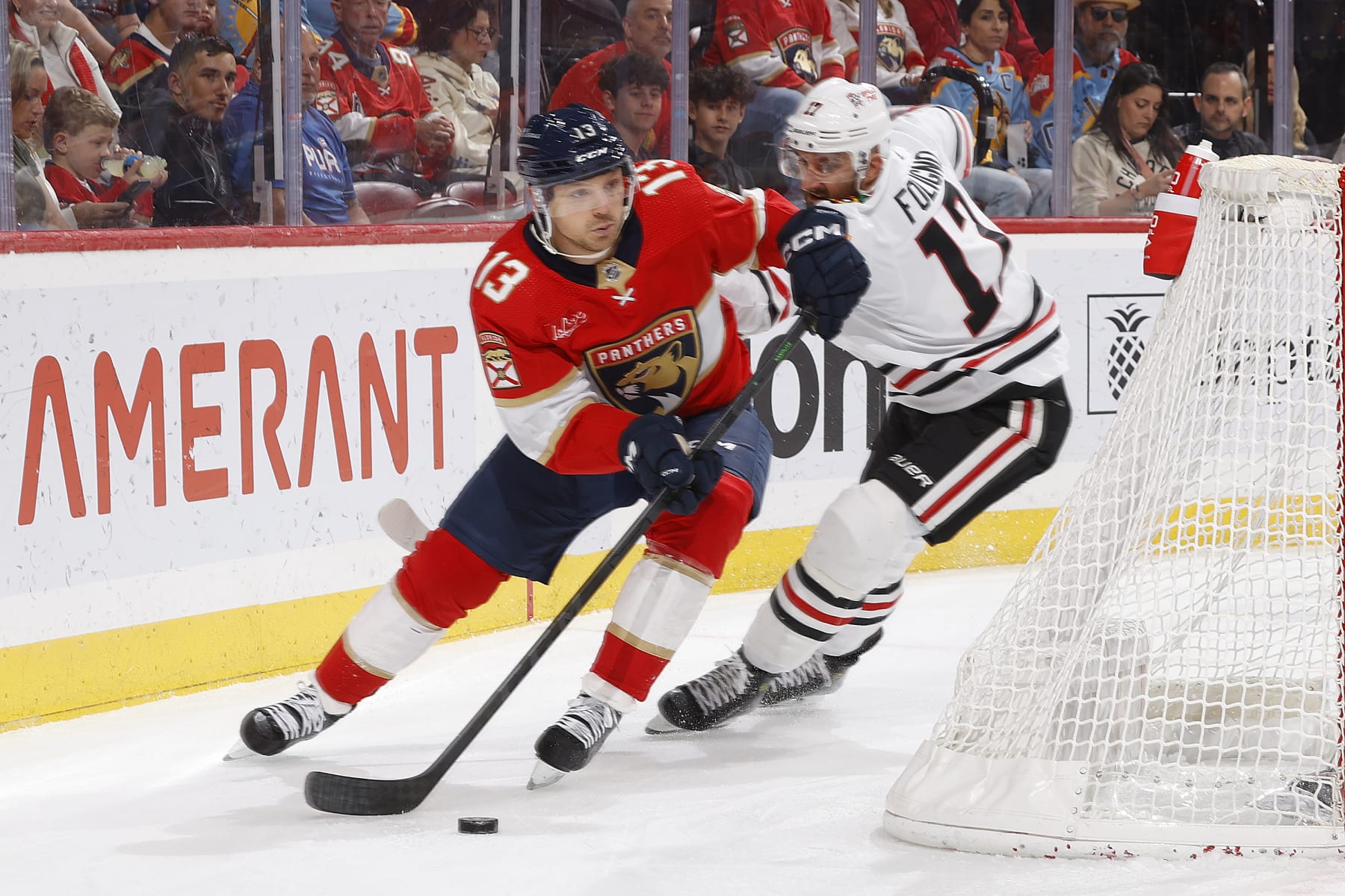 SUNRISE, FL - NOVEMBER 12: Nick Foligno #17 of the Chicago Blackhawks defends against Sam Reinhart #13 of the Florida Panthers during first period action at the Amerant Bank Arena on November 12, 2023 in Sunrise, Florida. (Photo by Joel Auerbach/Getty Images)