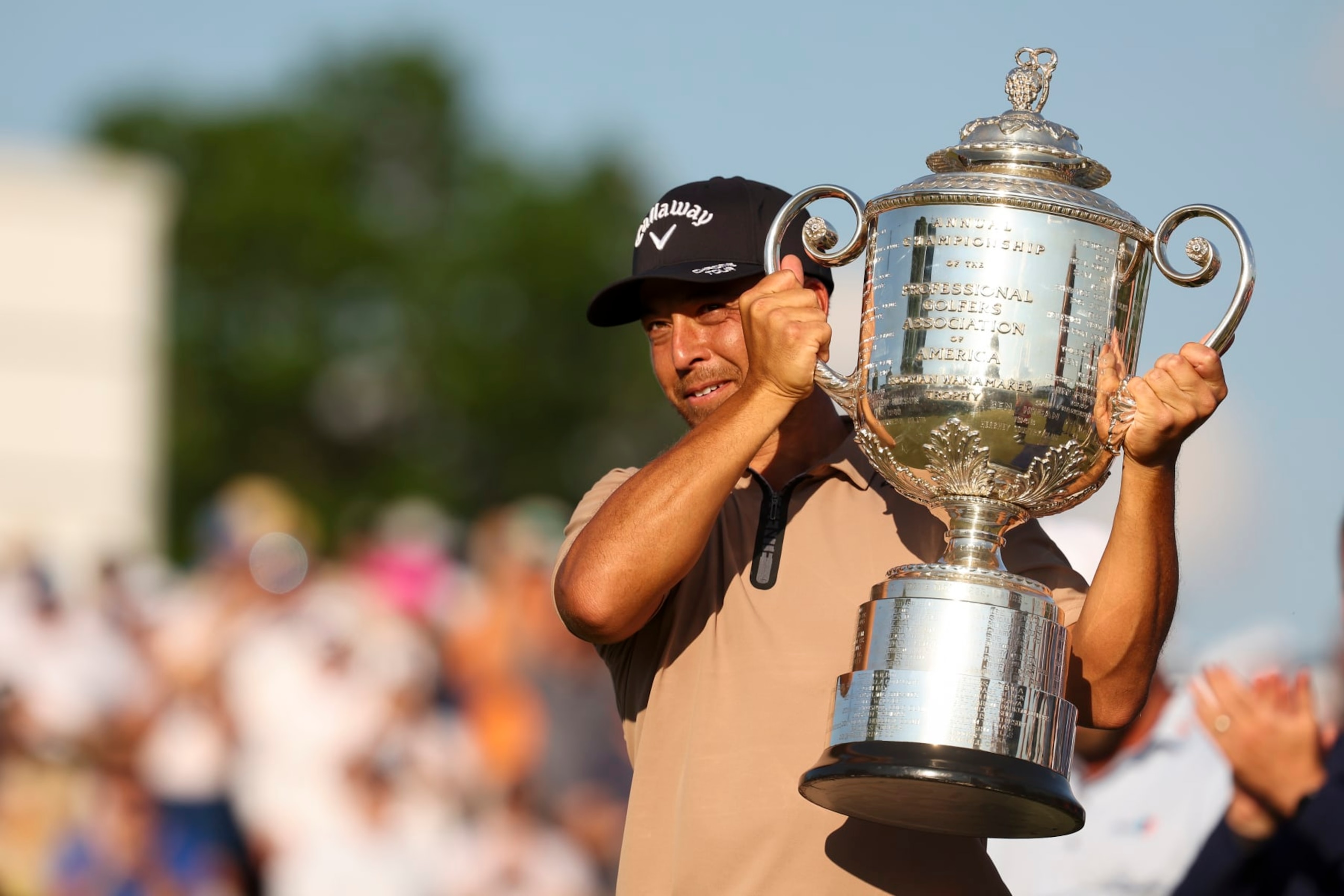 LOUISVILLE, KY - MAY 19: Xander Schauffele hold ups the PGA Championship Trophy during the final round of the PGA Championship at Valhalla Golf Club on Sunday, May 19, 2024 in Louisville, Kentucky. (Photo by Scott Taetsch/PGA of America via Getty Images)