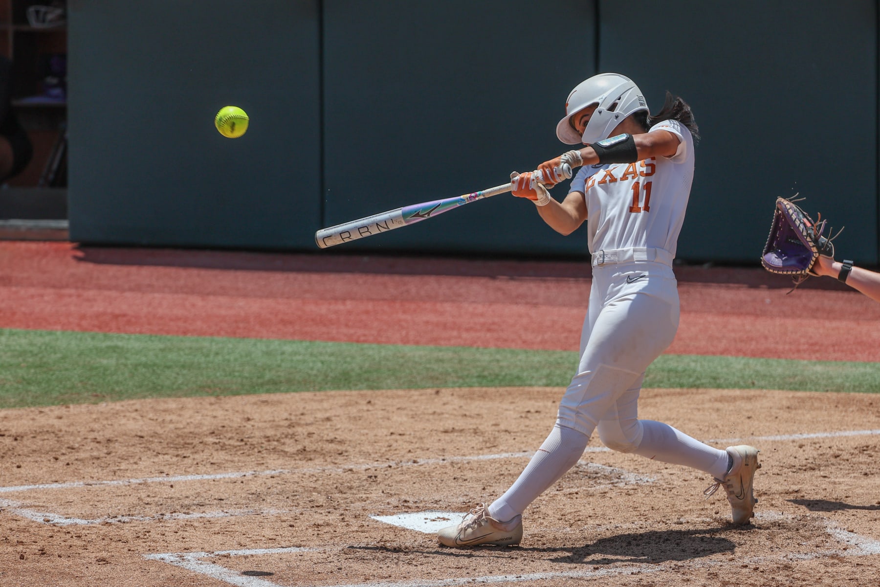AUSTIN, TX - MAY 18: Texas infielder Alyssa Washington (11) hits a two run home run during the NCAA Division I Regional game between Texas Longhorns and Northwestern Wildcats on May 18, 2024, at Red & Charline McCombs Field in Austin, TX. (Photo by David Buono/Icon Sportswire via Getty Images)