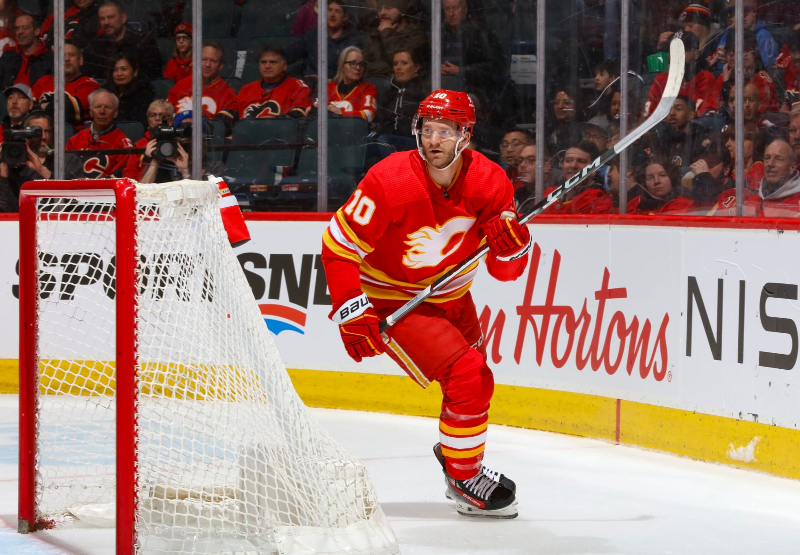CALGARY, AB - MARCH  24: Jonathan Huberdeau #10 of the Calgary Flames skates against the Buffalo Sabres at Scotiabank Saddledome on March 24, 2024 in Calgary, Alberta, Canada. (Photo by Gerry Thomas/NHLI via Getty Images)