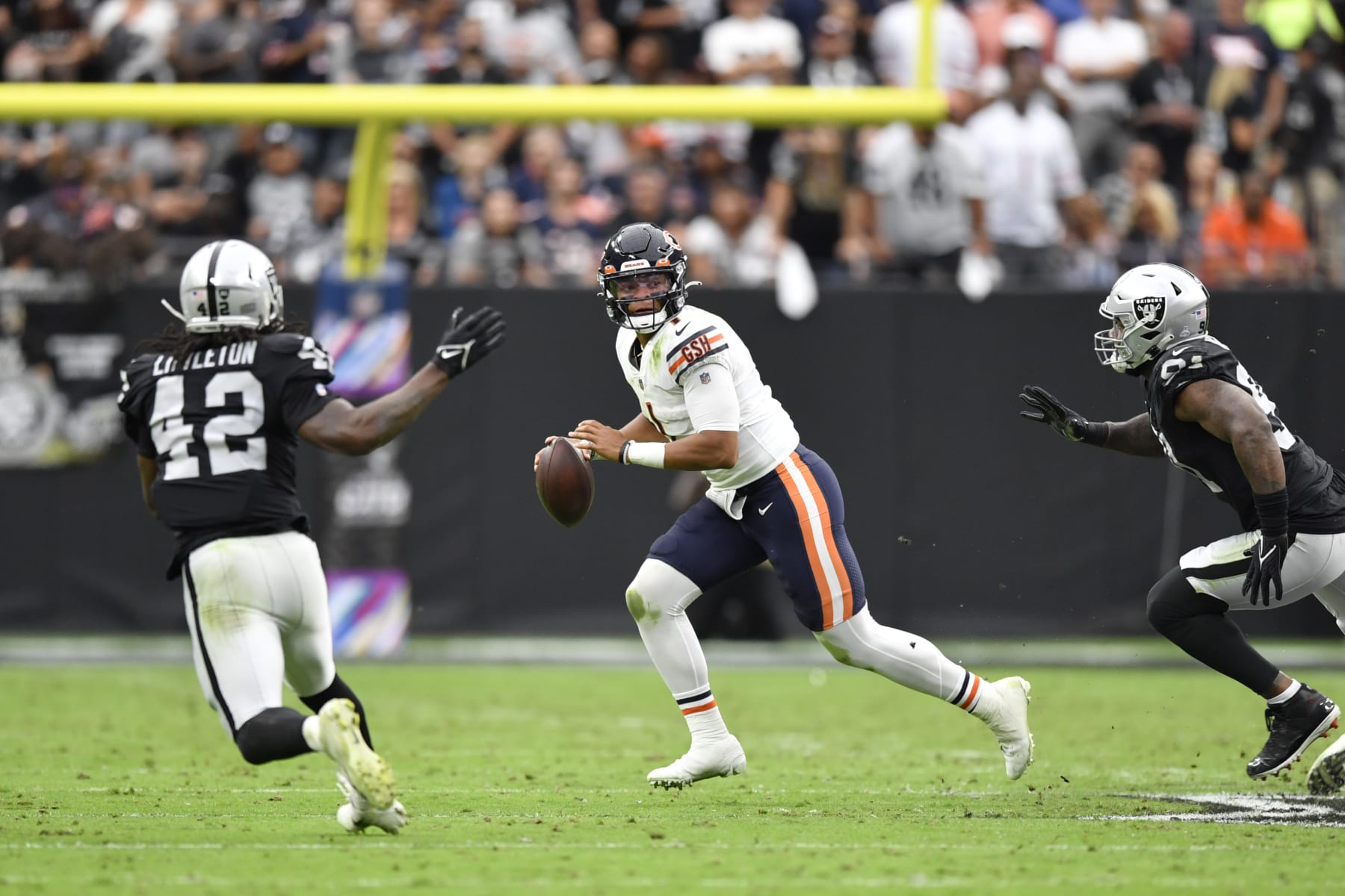 LAS VEGAS, NEVADA - OCTOBER 10:  Quarterback Justin Fields #1 of the Chicago Bears looks to throw against the Las Vegas Raiders during the first half of a game at Allegiant Stadium on October 10, 2021 in Las Vegas, Nevada. The Bears defeated the Raiders 20-9. (Photo by Chris Unger/Getty Images)