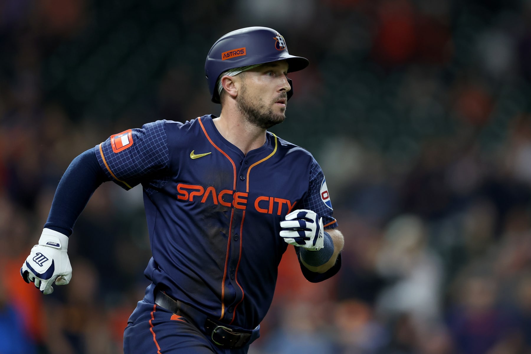 HOUSTON, TEXAS - MAY 13: Alex Bregman #2 of the Houston Astros doubles in the eighth inning against the Oakland Athletics at Minute Maid Park on May 13, 2024 in Houston, Texas. (Photo by Tim Warner/Getty Images)