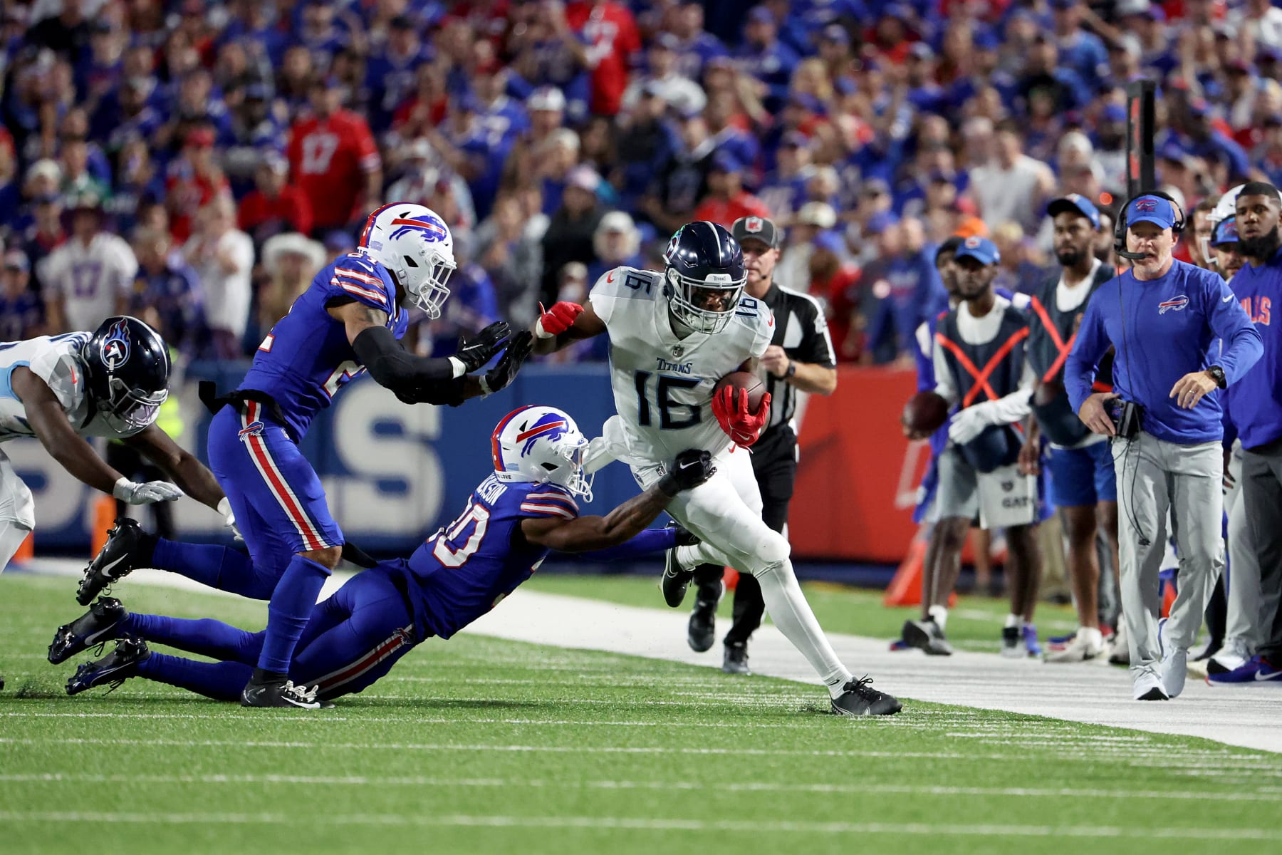 ORCHARD PARK, NEW YORK - SEPTEMBER 19: Treylon Burks #16 of the Tennessee Titans runs with the ball against Dane Jackson #30 of the Buffalo Bills during the first half of the game at Highmark Stadium on September 19, 2022 in Orchard Park, New York. (Photo by Timothy T Ludwig/Getty Images)