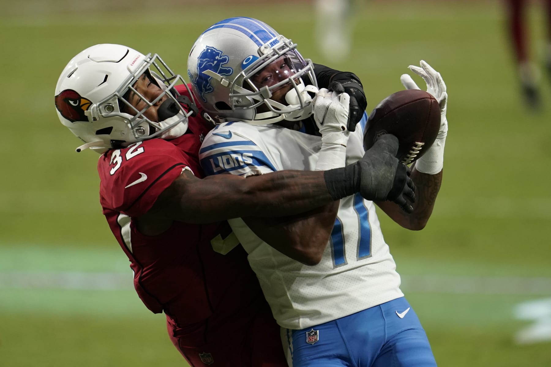 GLENDALE, ARIZONA - SEPTEMBER 27: Arizona Cardinals strong safety Budda Baker (32) attempts to disrupt the catch attempt by Marvin Hall #17 of the Detroit Lions] during an NFL football game against the Detroit Lions on September 27, 2020 in Glendale, Ariz. (Photo by Cooper Neill/Getty Images)