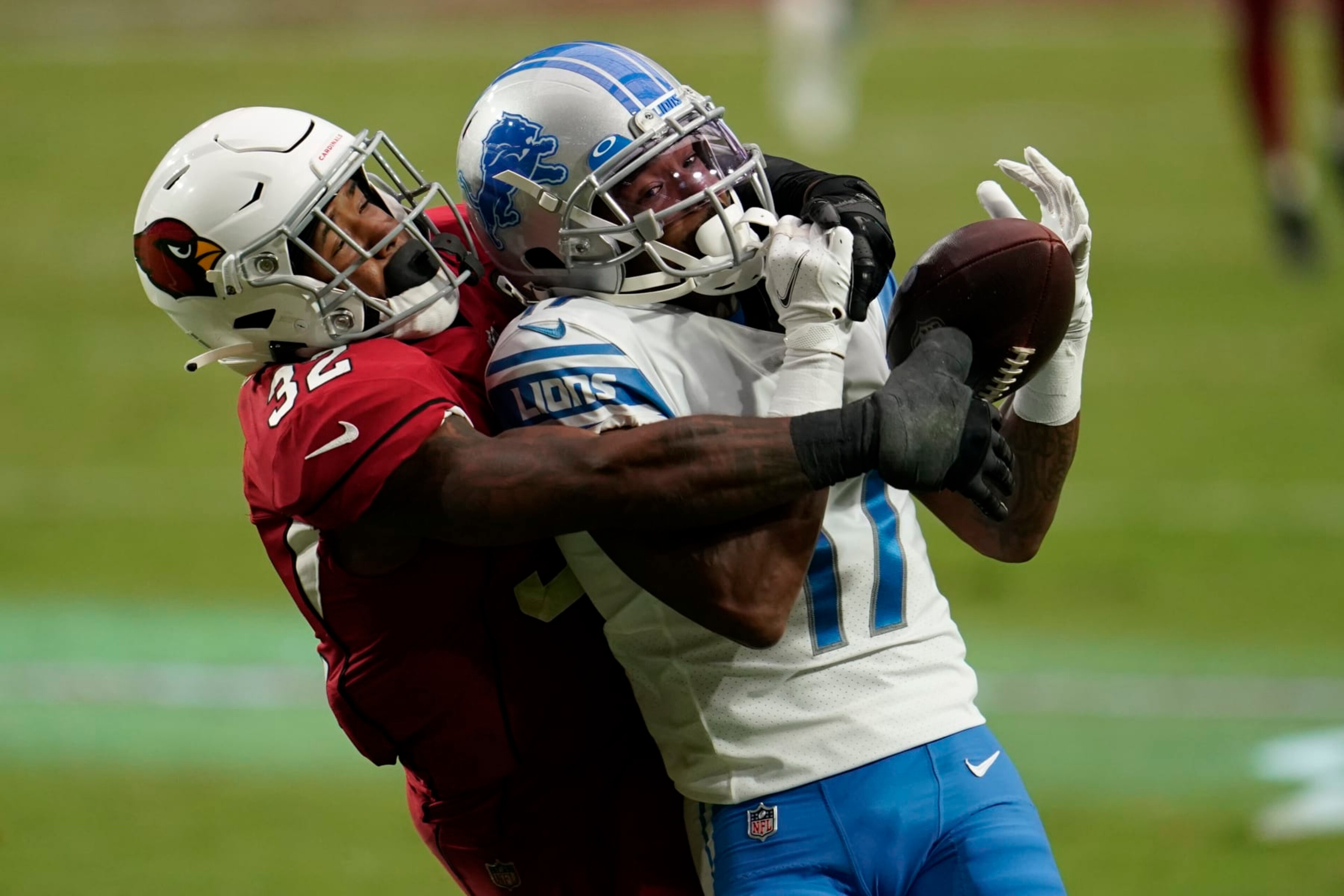 GLENDALE, ARIZONA - SEPTEMBER 27: Arizona Cardinals strong safety Budda Baker (32) attempts to disrupt the catch attempt by Marvin Hall #17 of the Detroit Lions] during an NFL football game against the Detroit Lions on September 27, 2020 in Glendale, Ariz. (Photo by Cooper Neill/Getty Images)