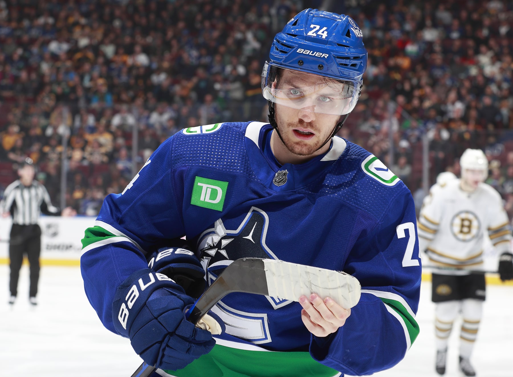 VANCOUVER, CANADA - FEBRUARY 24: Elias Lindholm #23 of the Vancouver Canucks skates to the bench during their NHL game against the Boston Bruins at Rogers Arena on February 24, 2024 in Vancouver, British Columbia, Canada.  (Photo by Jeff Vinnick/NHLI via Getty Images)