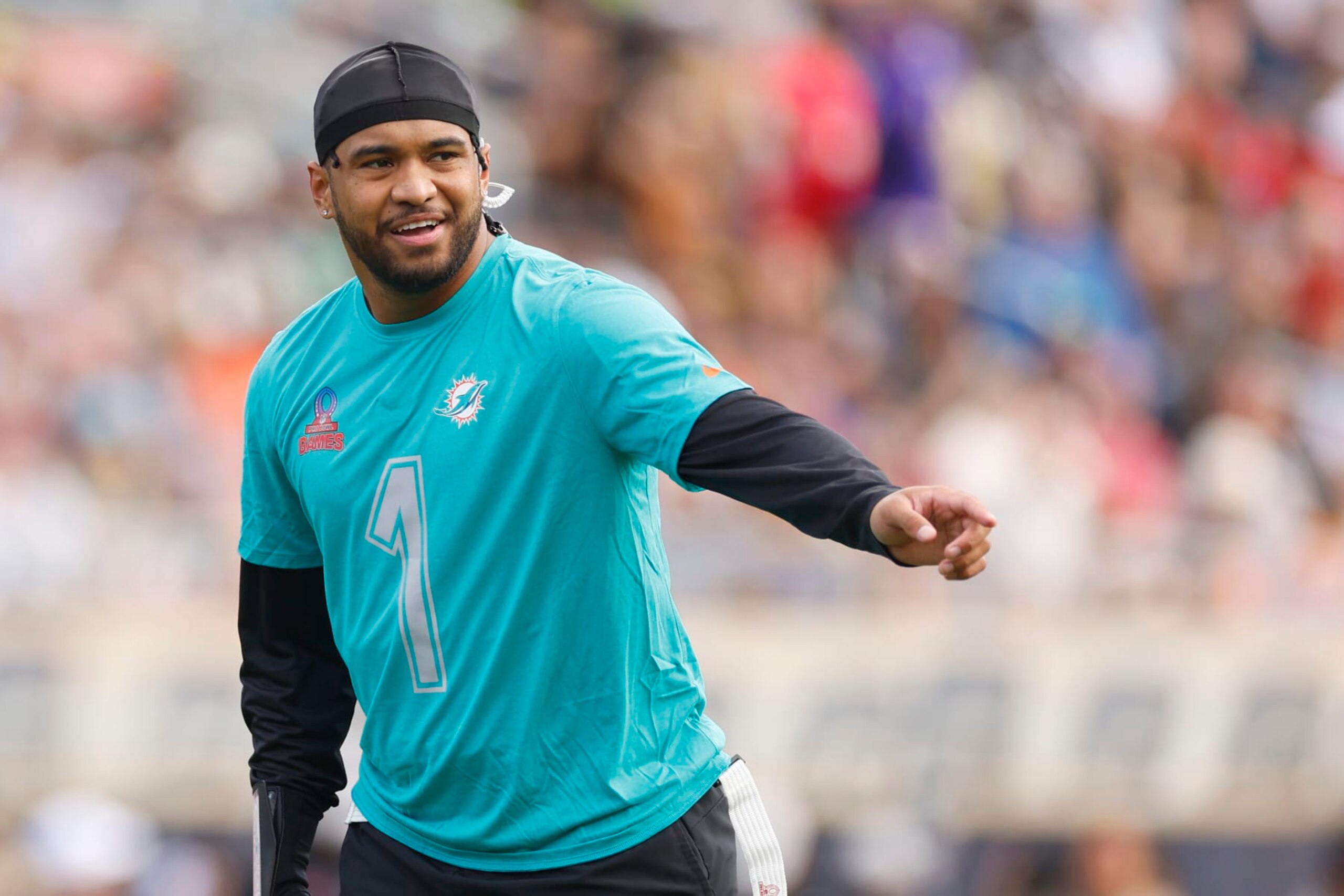 ORLANDO, FLORIDA - FEBRUARY 04: Tua Tagovailoa #1 of the Miami Dolphins and AFC reacts during the first half of the 2024 NFL Pro Bowl Games at Camping World Stadium on February 04, 2024 in Orlando, Florida. (Photo by Mike Ehrmann/Getty Images) ORLANDO, FLORIDA - FEBRUARY 04: Tua Tagovailoa #1 of the Miami Dolphins and AFC reacts during the first half of the 2024 NFL Pro Bowl Games at Camping World Stadium on February 04, 2024 in Orlando, Florida. (Photo by Mike Ehrmann/Getty Images)