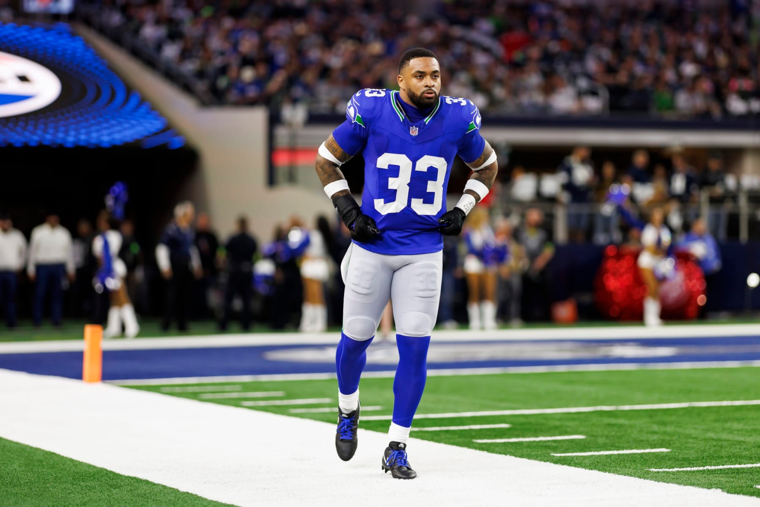 ARLINGTON, TEXAS - NOVEMBER 30: Jamal Adams #33 of the Seattle Seahawks looks on from the sideline before an NFL football game against the Dallas Cowboys at AT&T Stadium on November 30, 2023 in Arlington, Texas. (Photo by Ryan Kang/Getty Images)