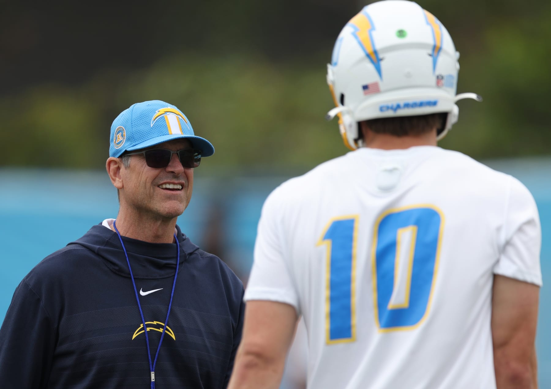 COSTA MESA, CALIFORNIA - MAY 20: Head coach Jim Harbaugh and quarterback Justin Herbert during a Los Angeles Chargers OTA offseason workout on May 20, 2024 in Costa Mesa, California. (Photo by Harry How/Getty Images)