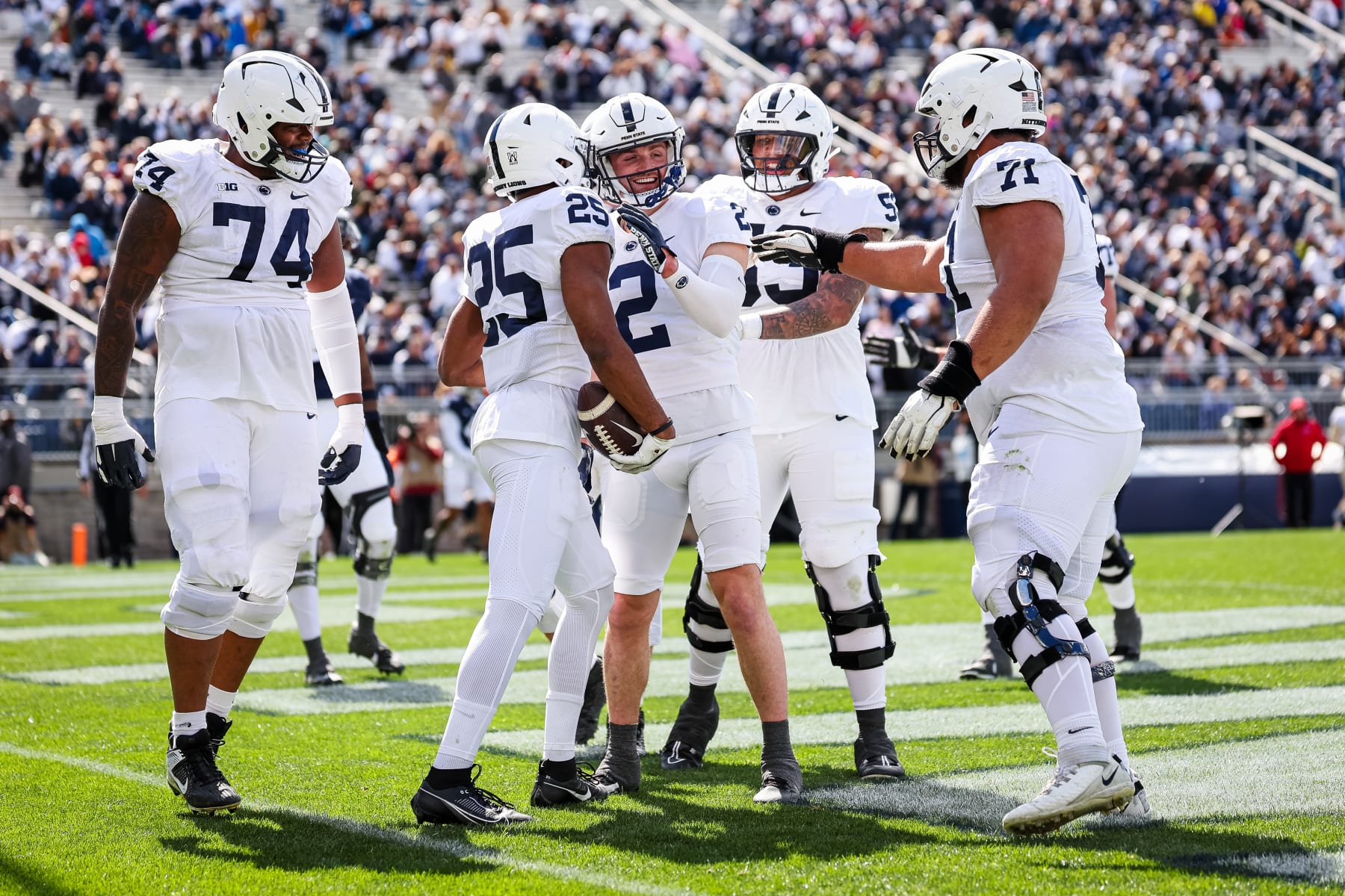 STATE COLLEGE, PA - APRIL 13: Quinton Martin Jr. #25 celebrates with teammates after scoring a touchdown during the Penn State Spring Football Game at Beaver Stadium on April 13, 2024 in State College, Pennsylvania. (Photo by Scott Taetsch/Getty Images)