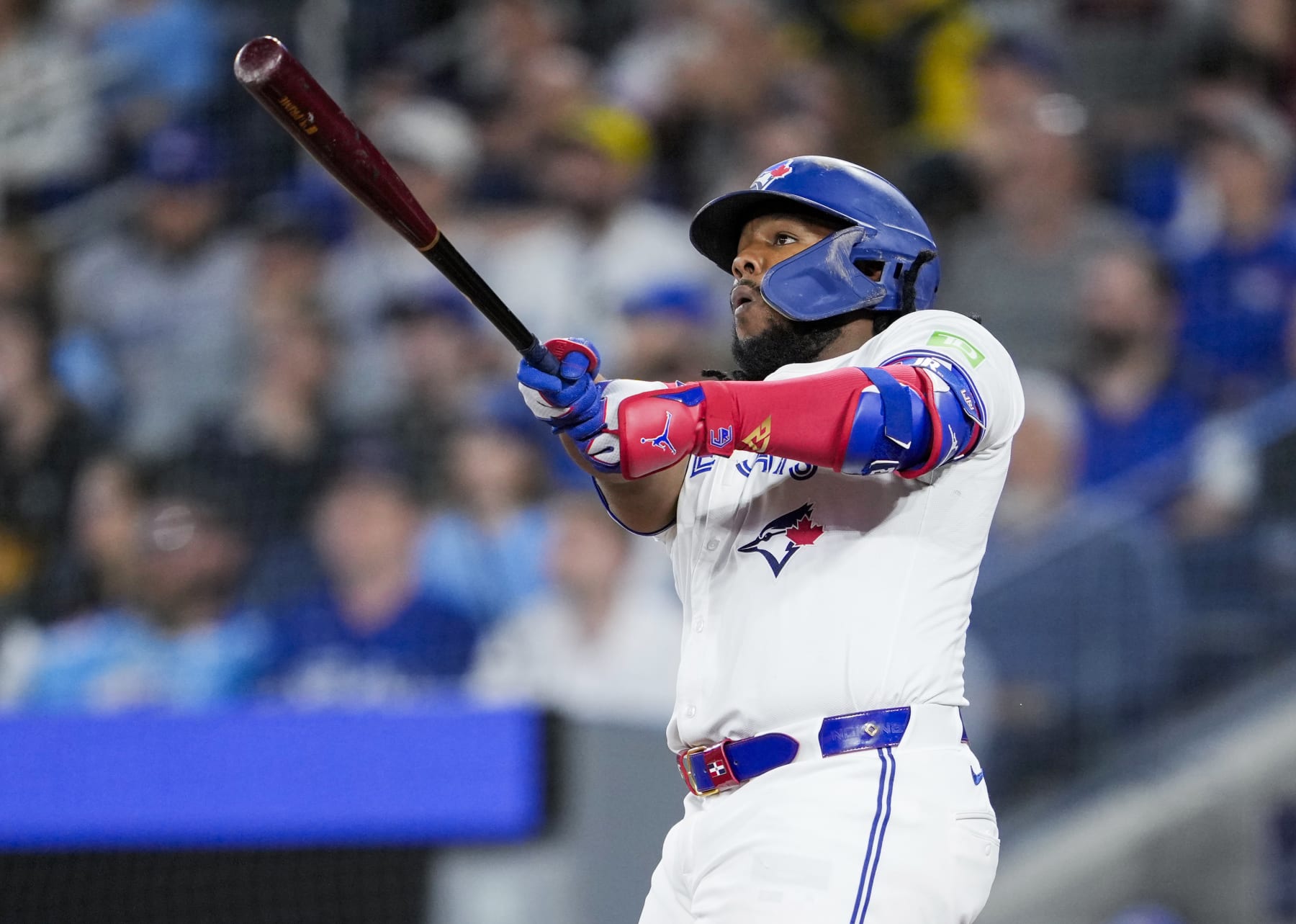 TORONTO, ON - APRIL 10: Vladimir Guerrero #27 of the Toronto Blue Jays hits a home run against the Seattle Mariners during the seventh inning in their MLB game at the Rogers Centre on April 10, 2024 in Toronto, Ontario, Canada. (Photo by Mark Blinch/Getty Images)
