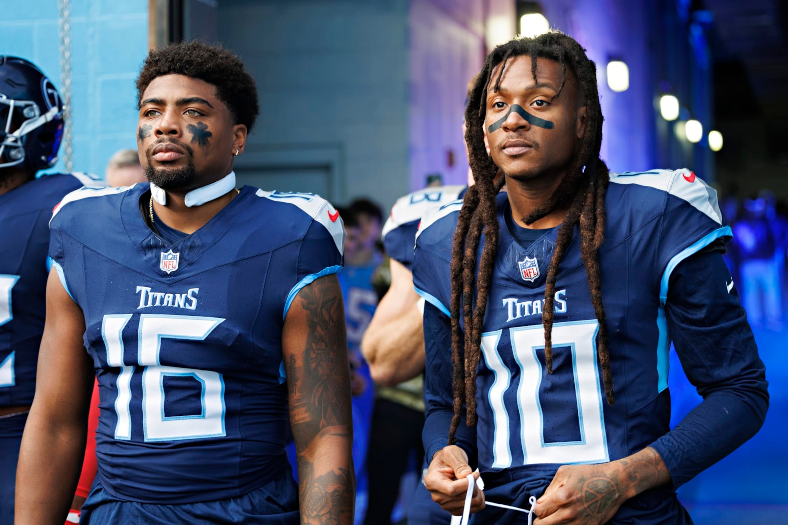 NASHVILLE, TENNESSEE - DECEMBER 3: Treylon Burks #16 and DeAndre Hopkins #10 of the Tennessee Titans prepares to run onto the field before the game against the Indianapolis Colts at Nissan Stadium on December 3, 2023 in Nashville, Tennessee. The Colts defeated the Titans 31-28.  (Photo by Wesley Hitt/Getty Images)